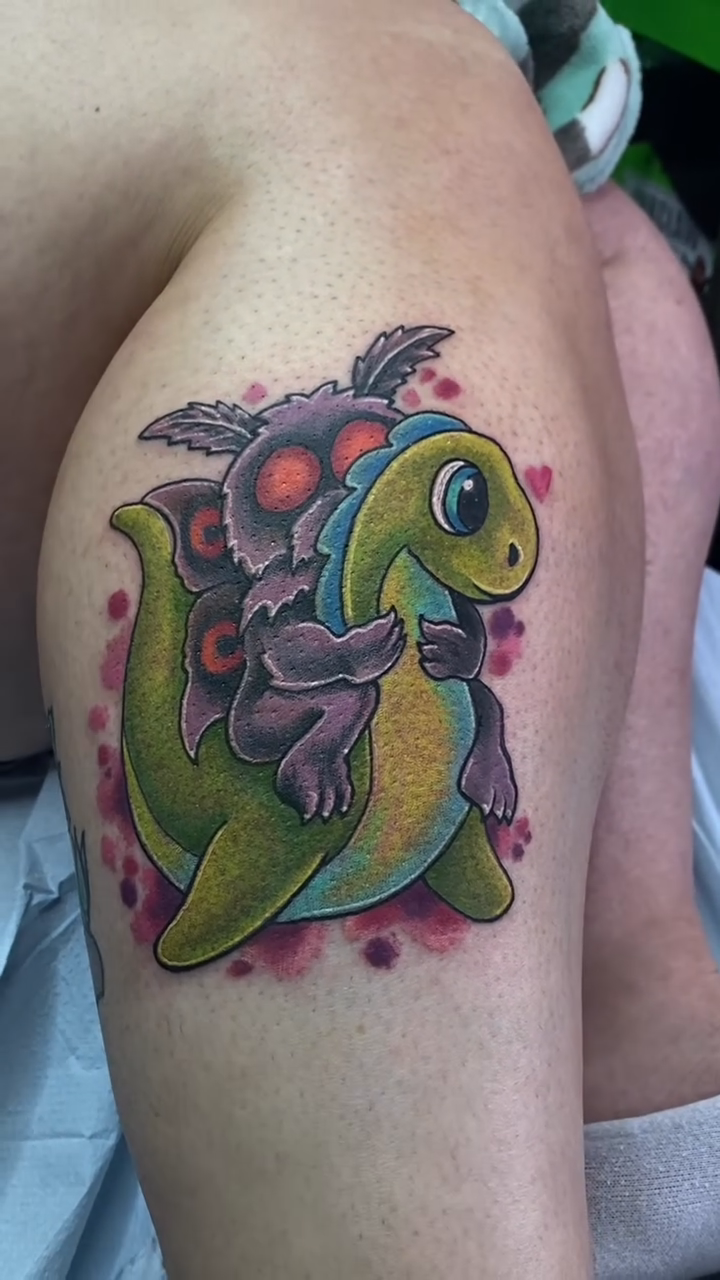 Dinosaur with a turtle shell new school tattoo by Loki Shane DeFriece