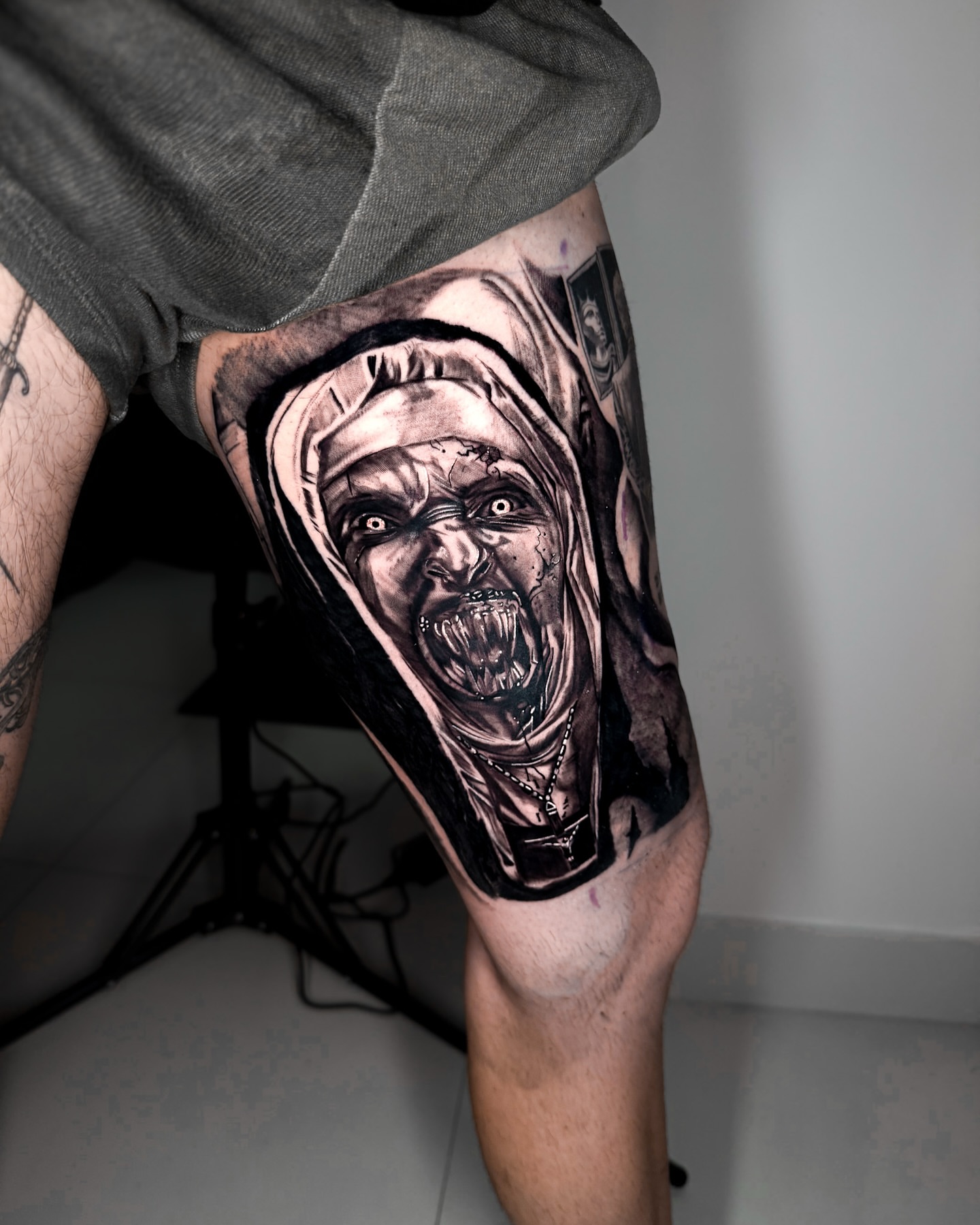Horror nun realism tattoo on the thigh by The Tattoo Plug