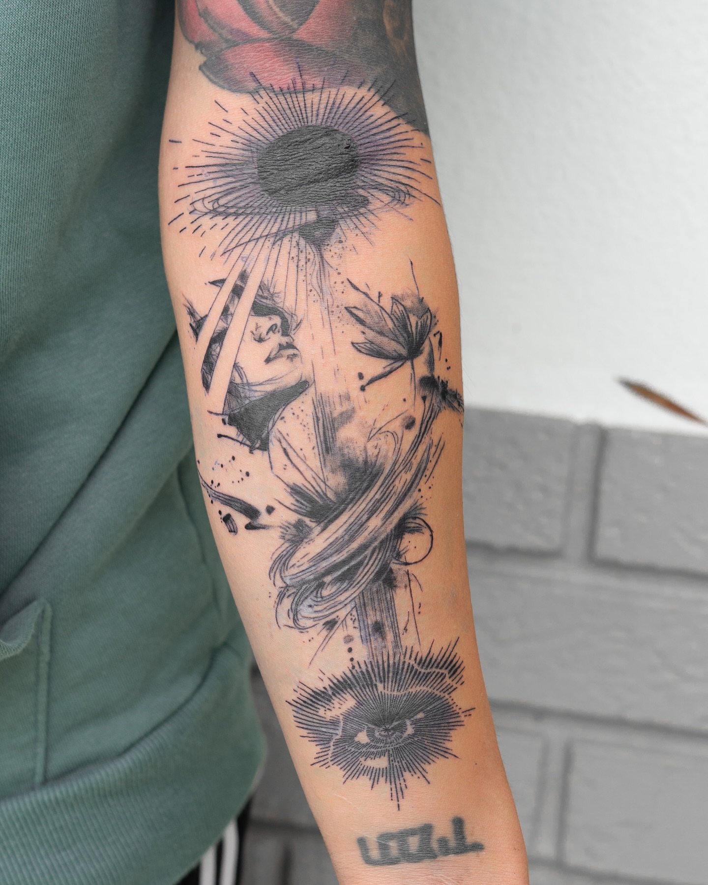 Woman with sunburst dotwork tattoo on the forearm by The Tattoo Plug