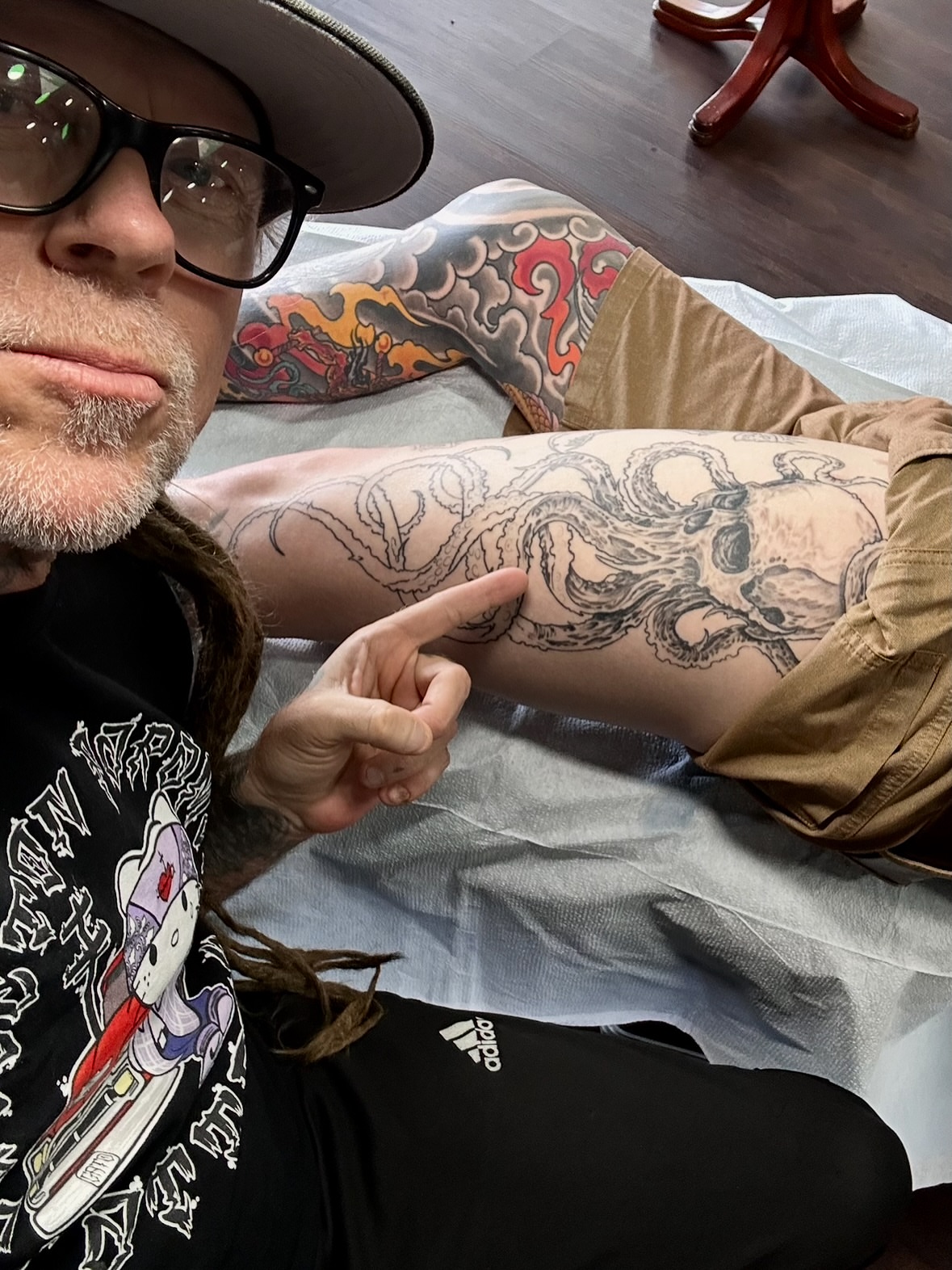 Octopus black and grey tattoo on the forearm by Culleton Paramore