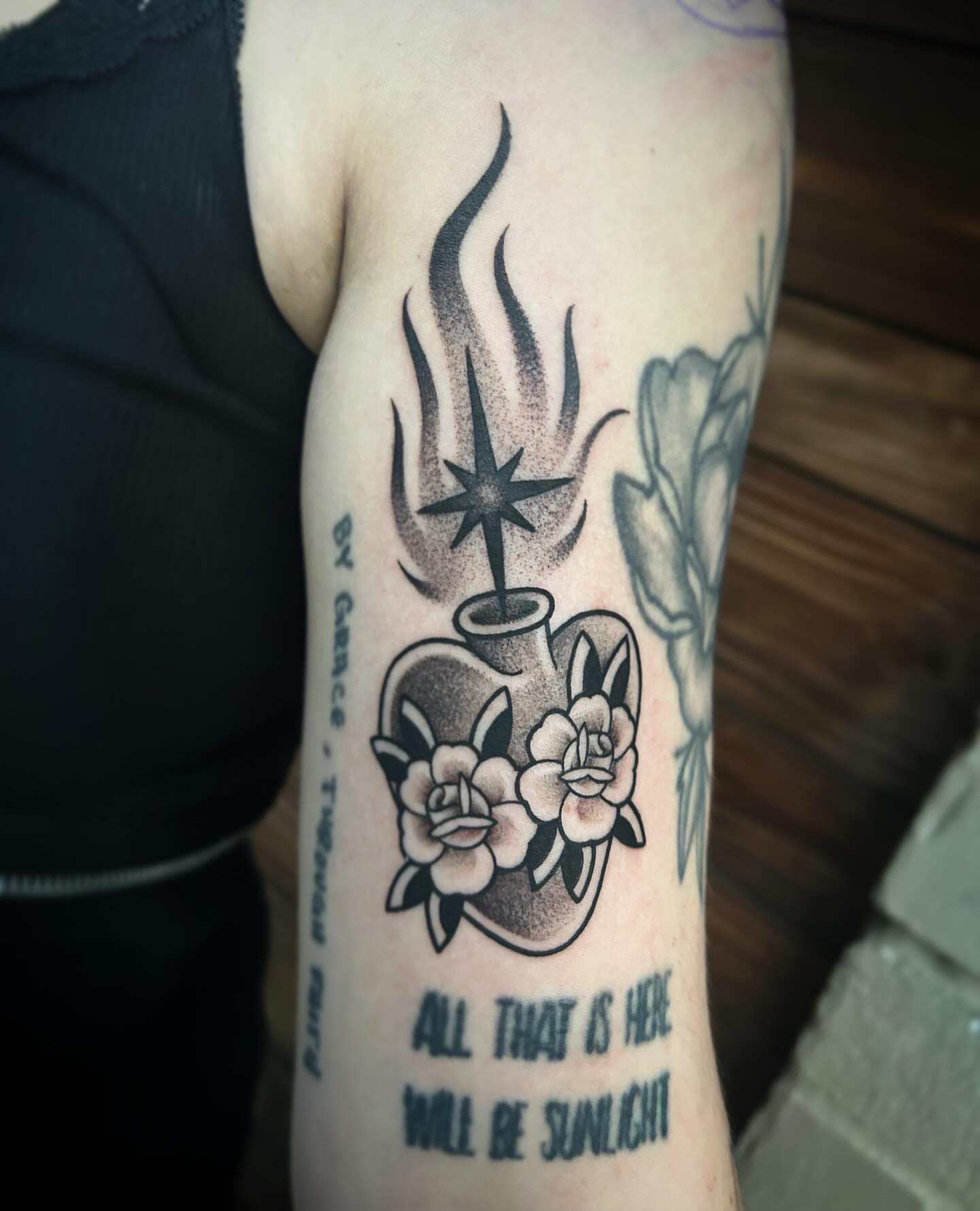 Flame, vase, roses dotwork tattoo on the forearm by Kayla Shoffner