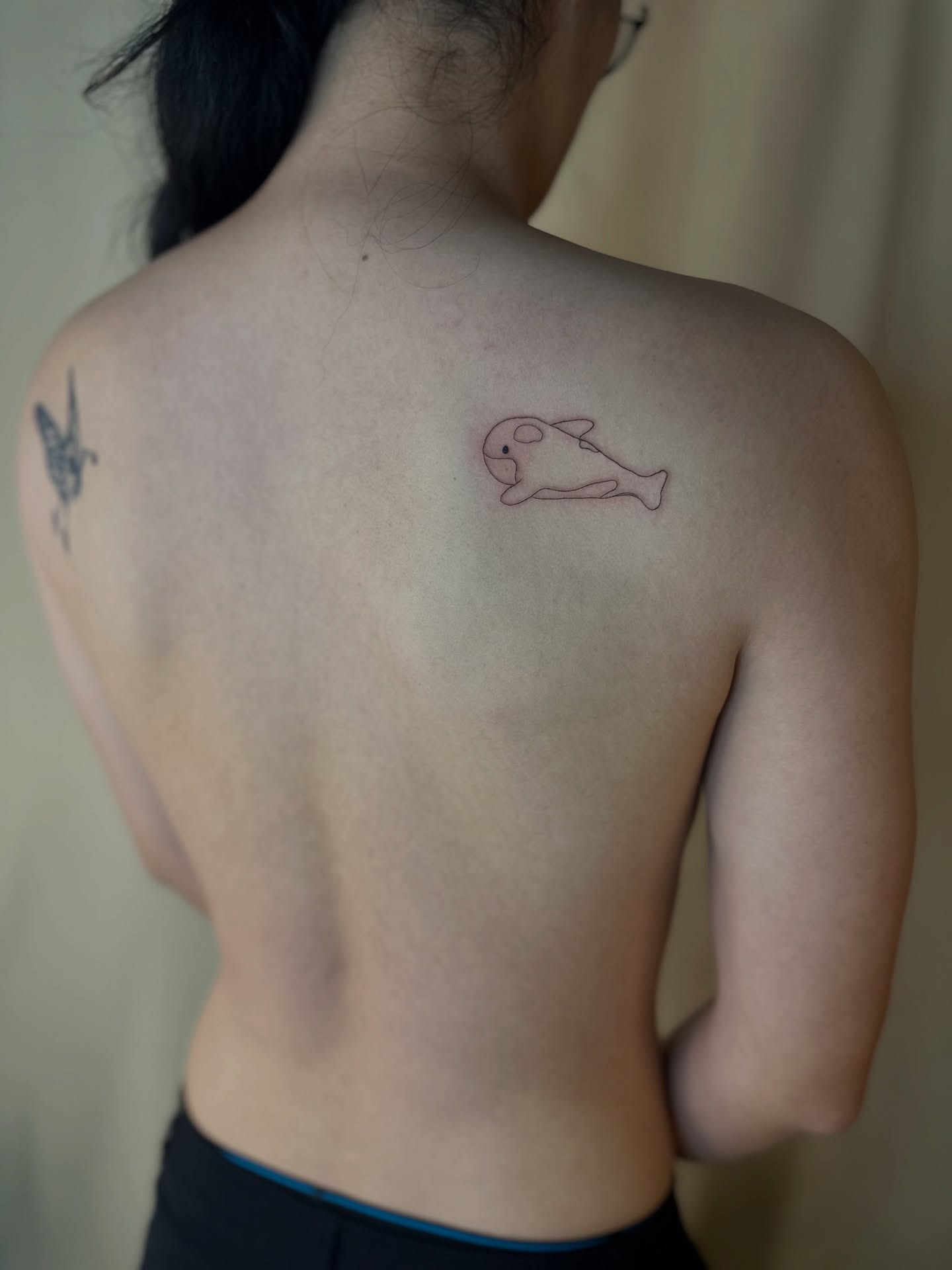 Whale minimalist tattoo on the back by Cherry🥀