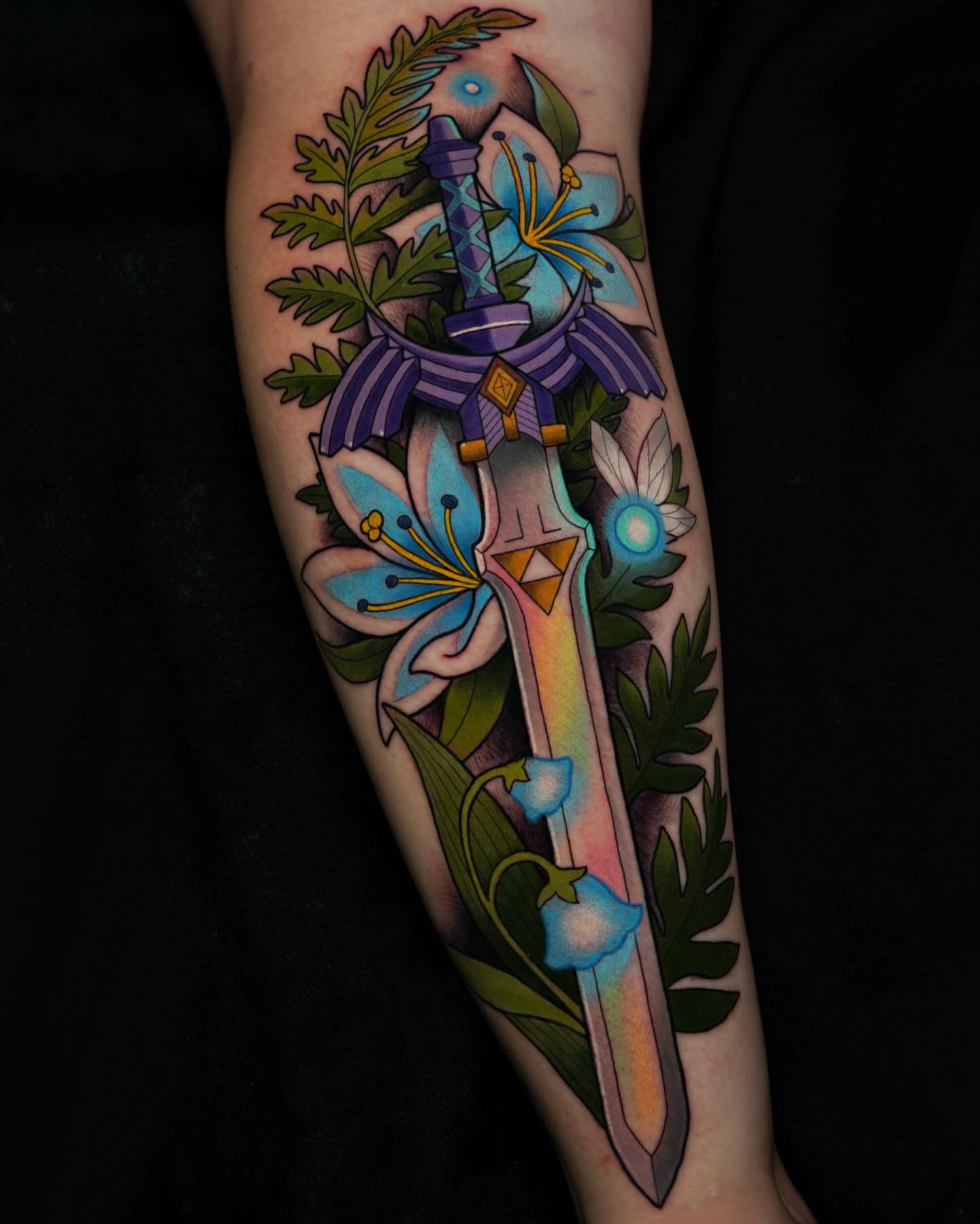 Sword and flowers American traditional tattoo on the forearm by Brooke Borden