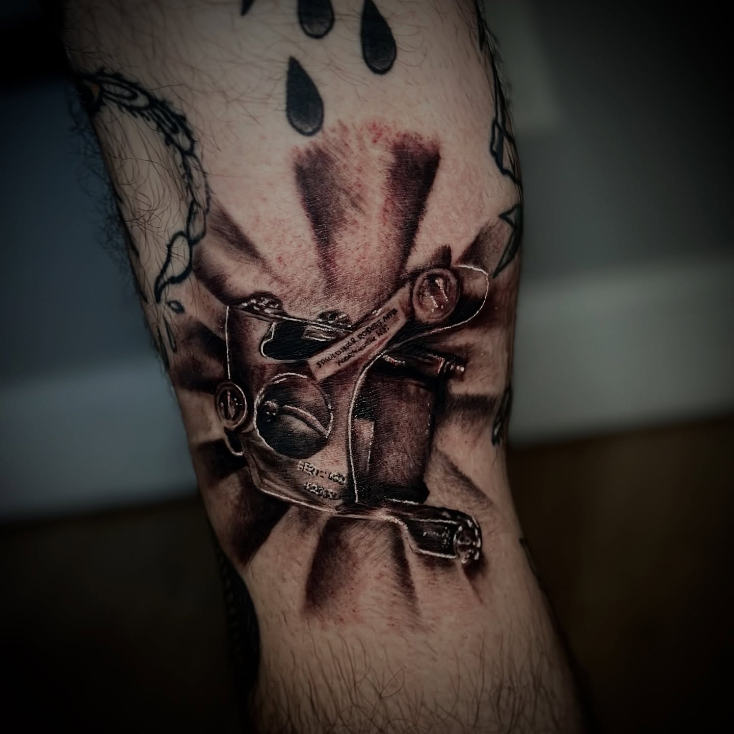 Mechanical device realism tattoo on the forearm by Ty East