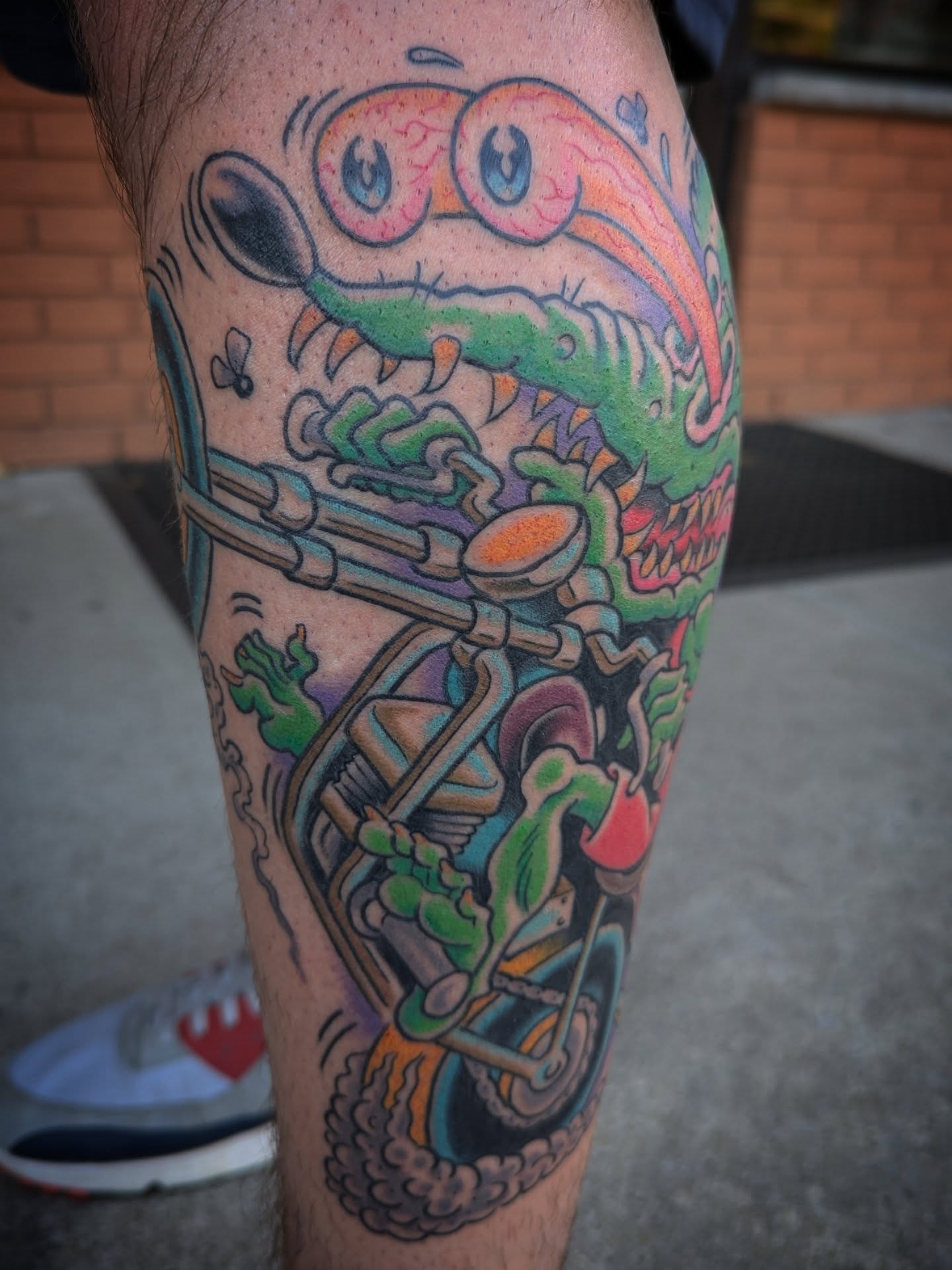 Lobster on motorcycle new school tattoo on the leg by Ryan Slegel