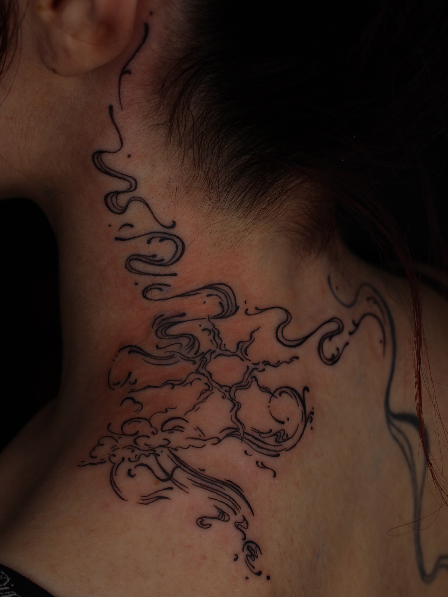 Smoke black and grey tattoo on the neck by Jessica Roberts