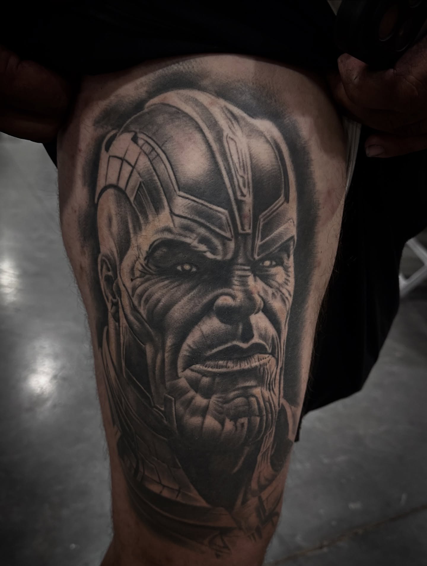 Thanos realism tattoo on the thigh by Tattoo Artist - the Goat