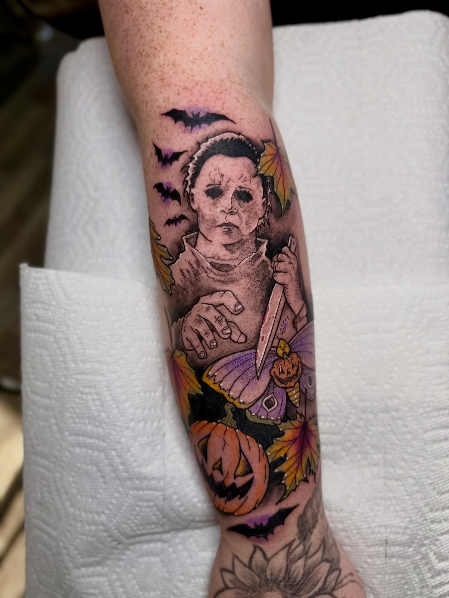 Michael Myers dark realism tattoo on the forearm by Ashley Laine Evans