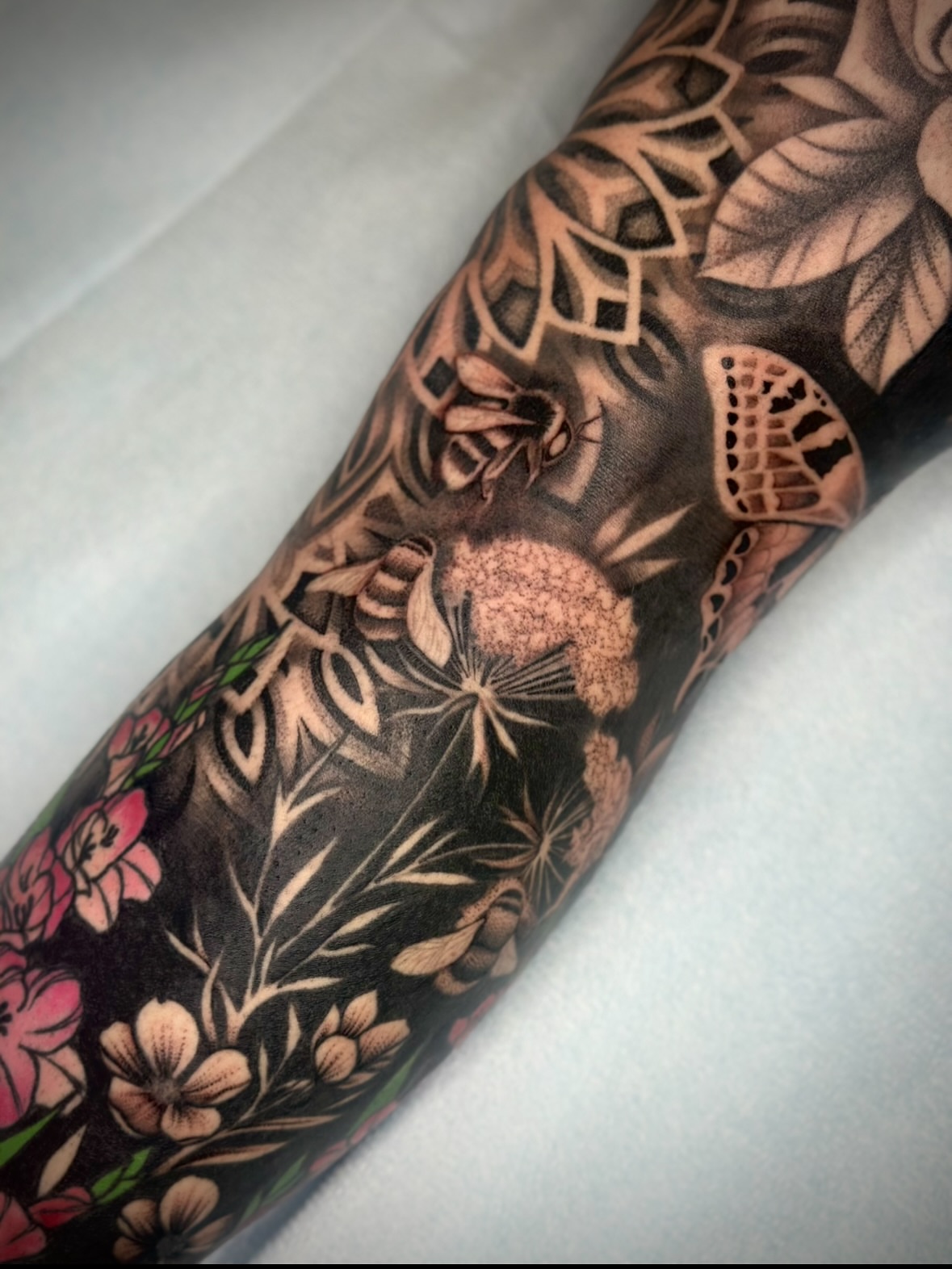 Floral bouquet realism tattoo on the forearm by Feliz Manzanedo, Prescott, Arizona