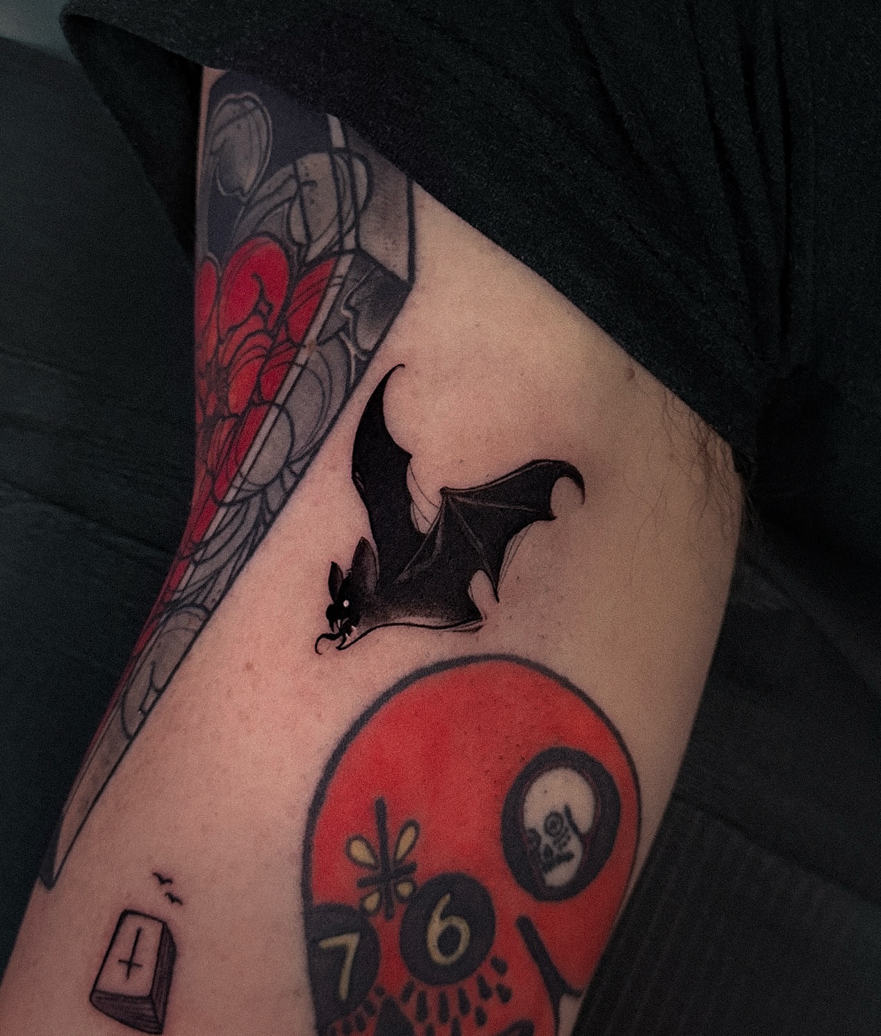 Bat and skull American traditional tattoo on the forearm by Tattoo Artist 👩🏻‍🎨 ATX