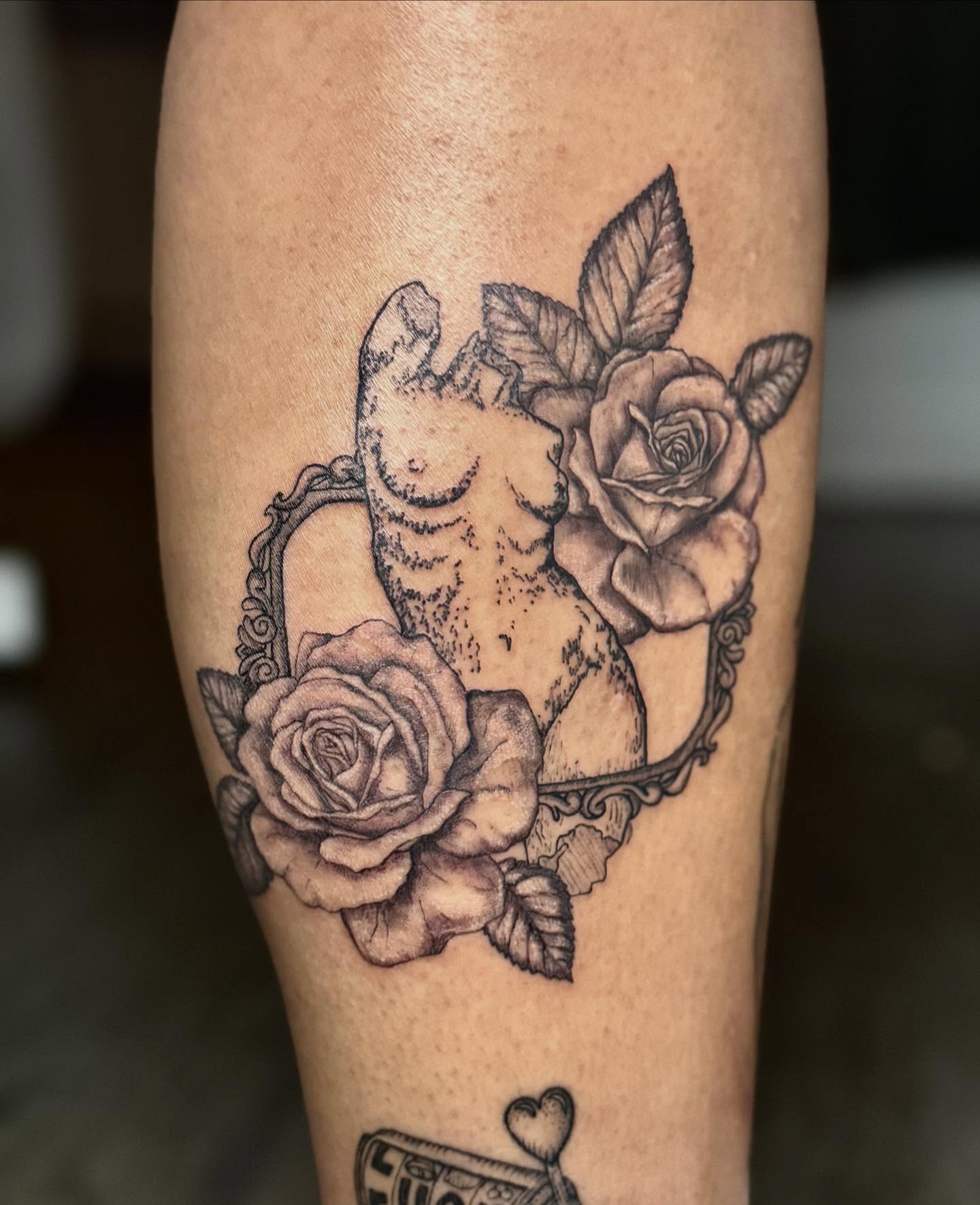 Cat and roses realism tattoo on the forearm by Tyla Pistak, Seattle, Washington