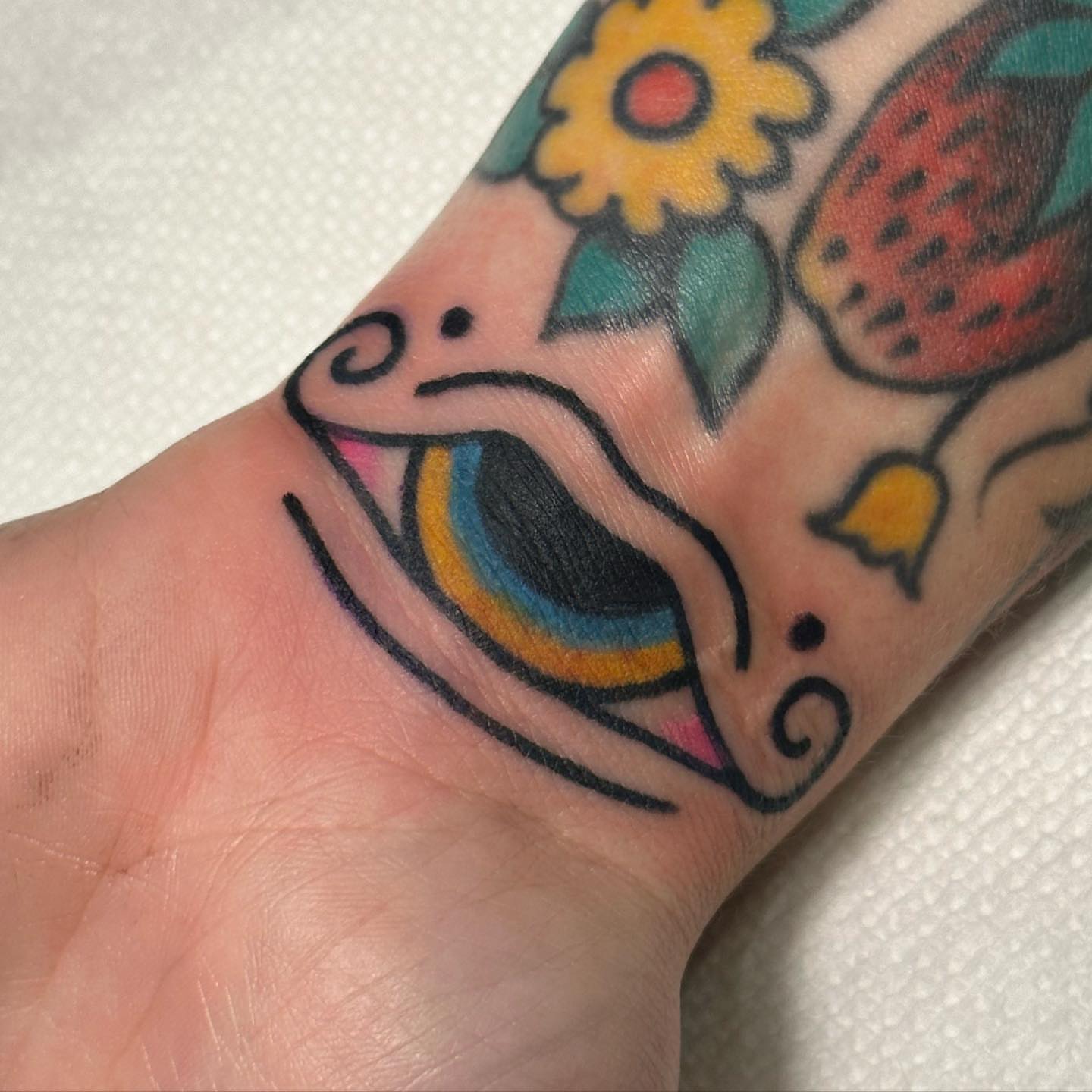 Day of the dead skull American traditional tattoo on the forearm by Alexa Wolfkiel