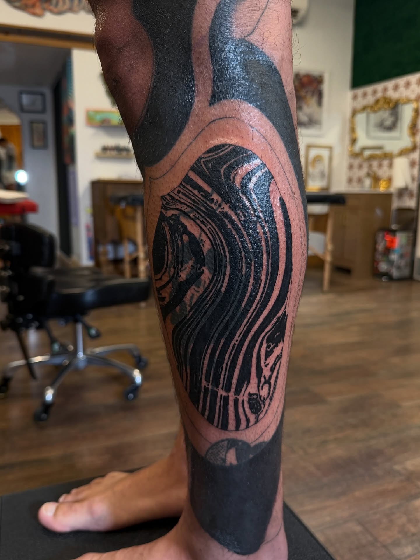 Abstract pattern black and grey tattoo on the calf by Denver Blackout Tattoo Specialist - Anthony