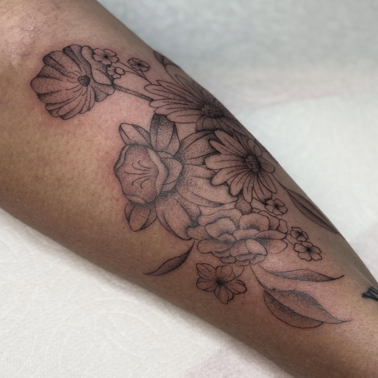 Floral bouquet black and grey tattoo on the forearm by chloe jeanel estrada