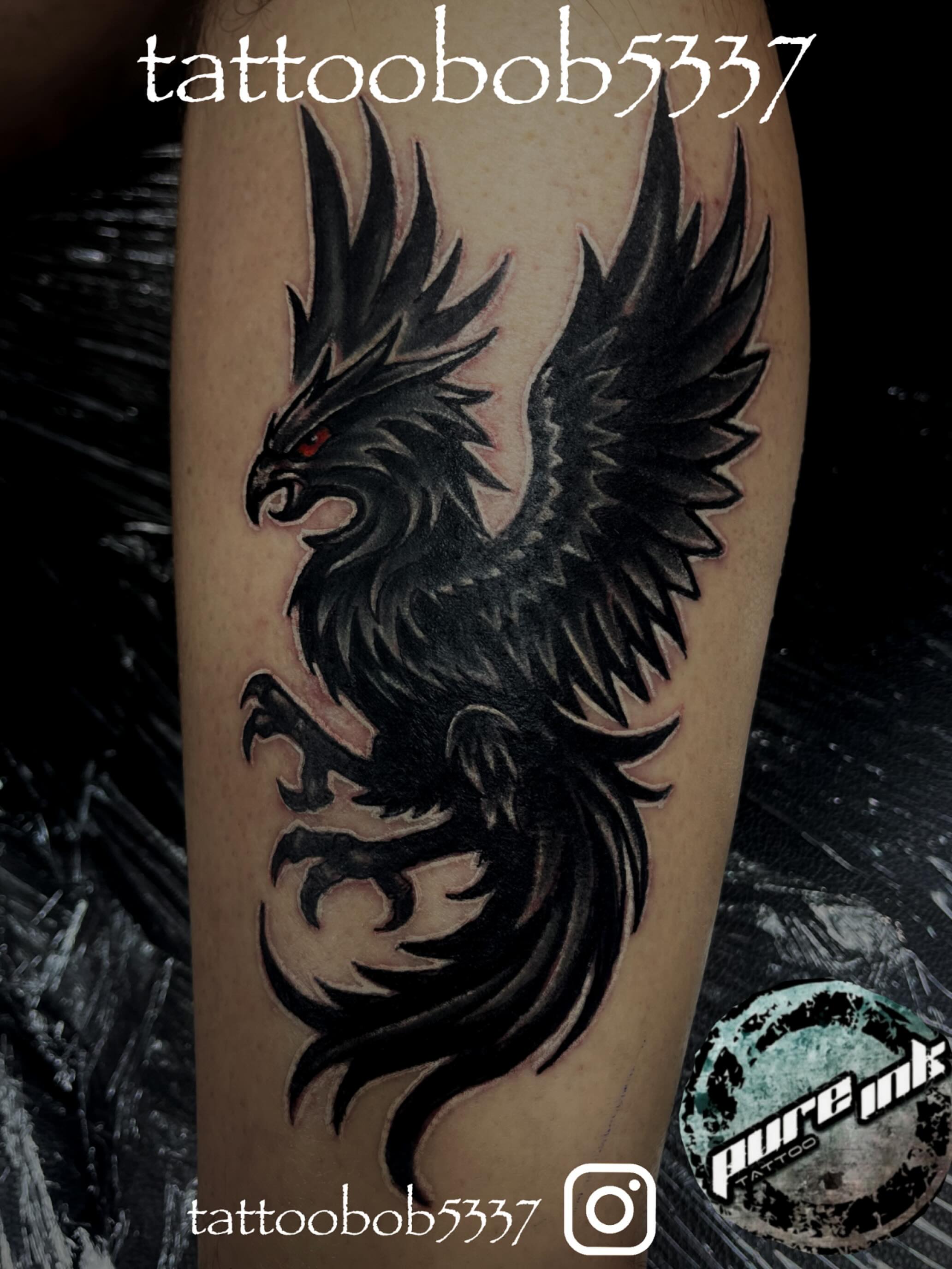 Phoenix black and grey tattoo on the forearm by Bobby Glennon