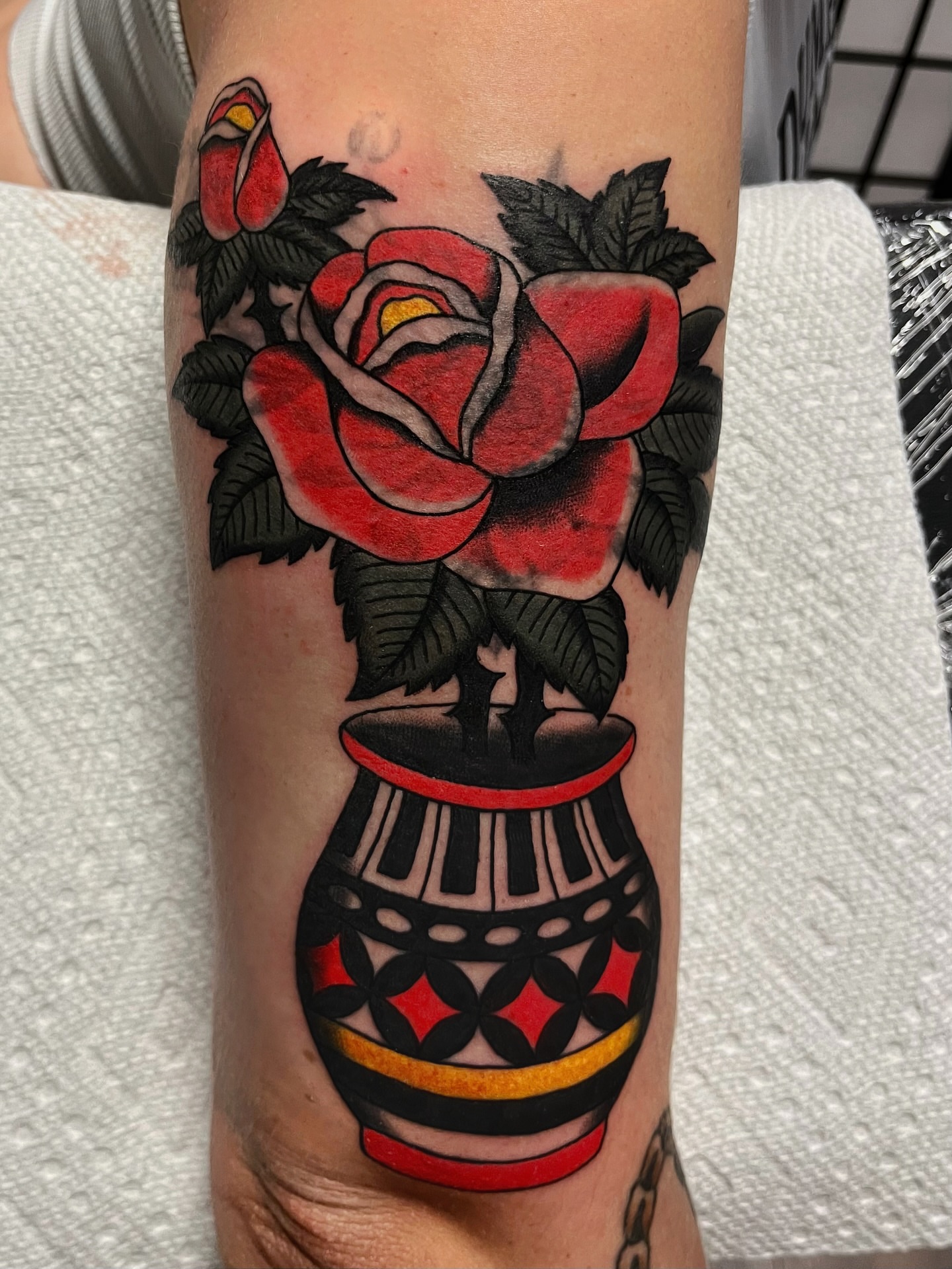 Red roses in vase American traditional tattoo on the forearm by Elizabeth Summers ❨・¨⬮ Traditional Tattoo