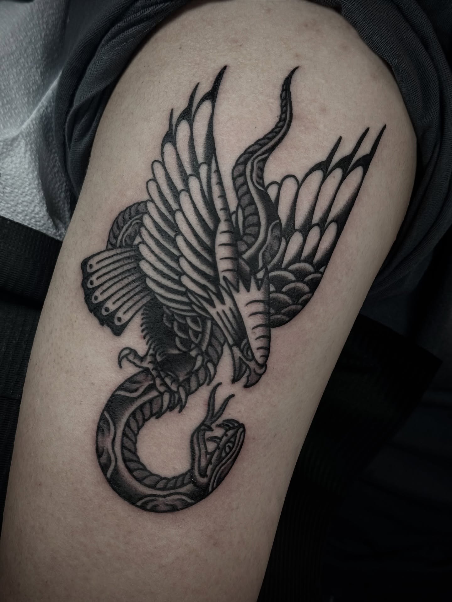 Phoenix black and grey tattoo on the shoulder by Ally noel