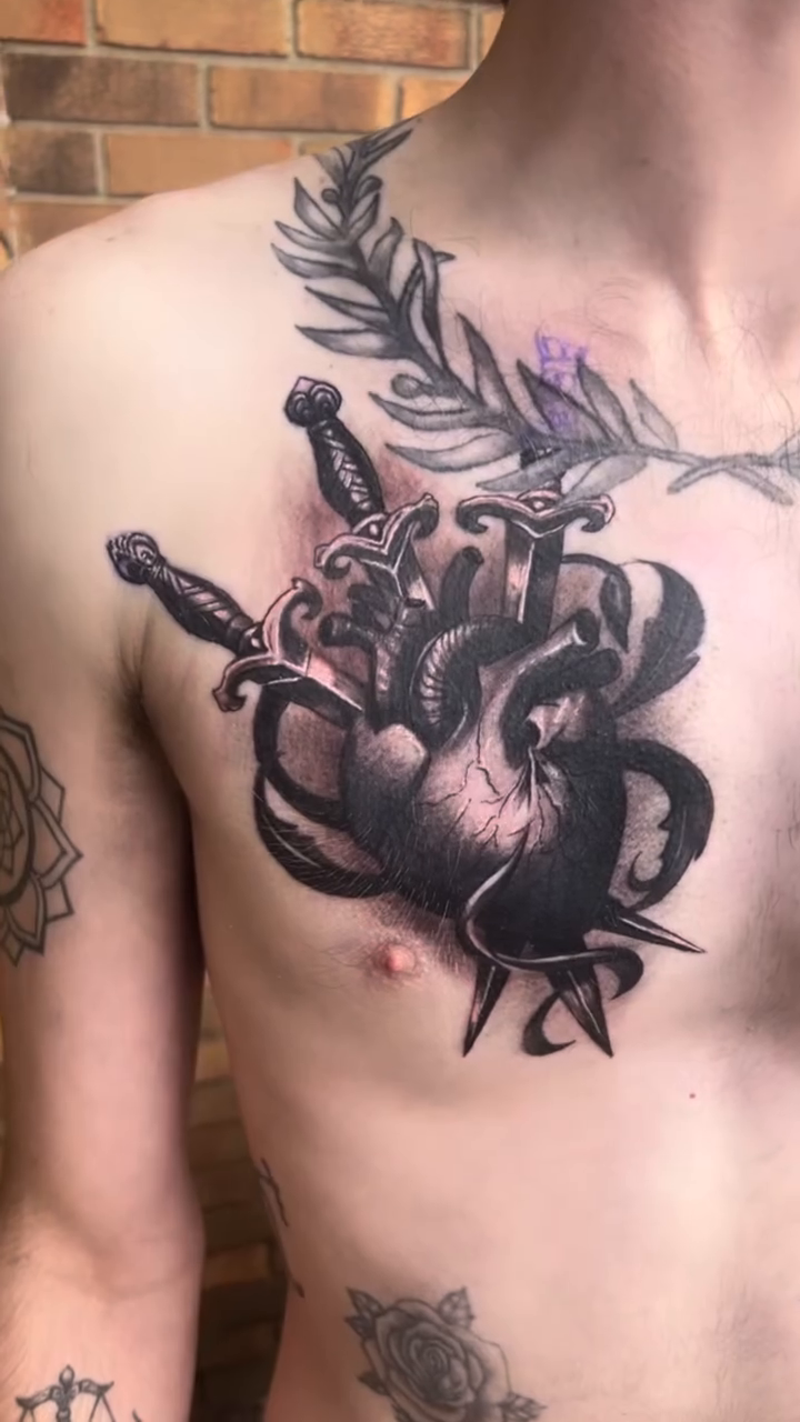Heart with swords realism tattoo by Mark Phillip Chavez