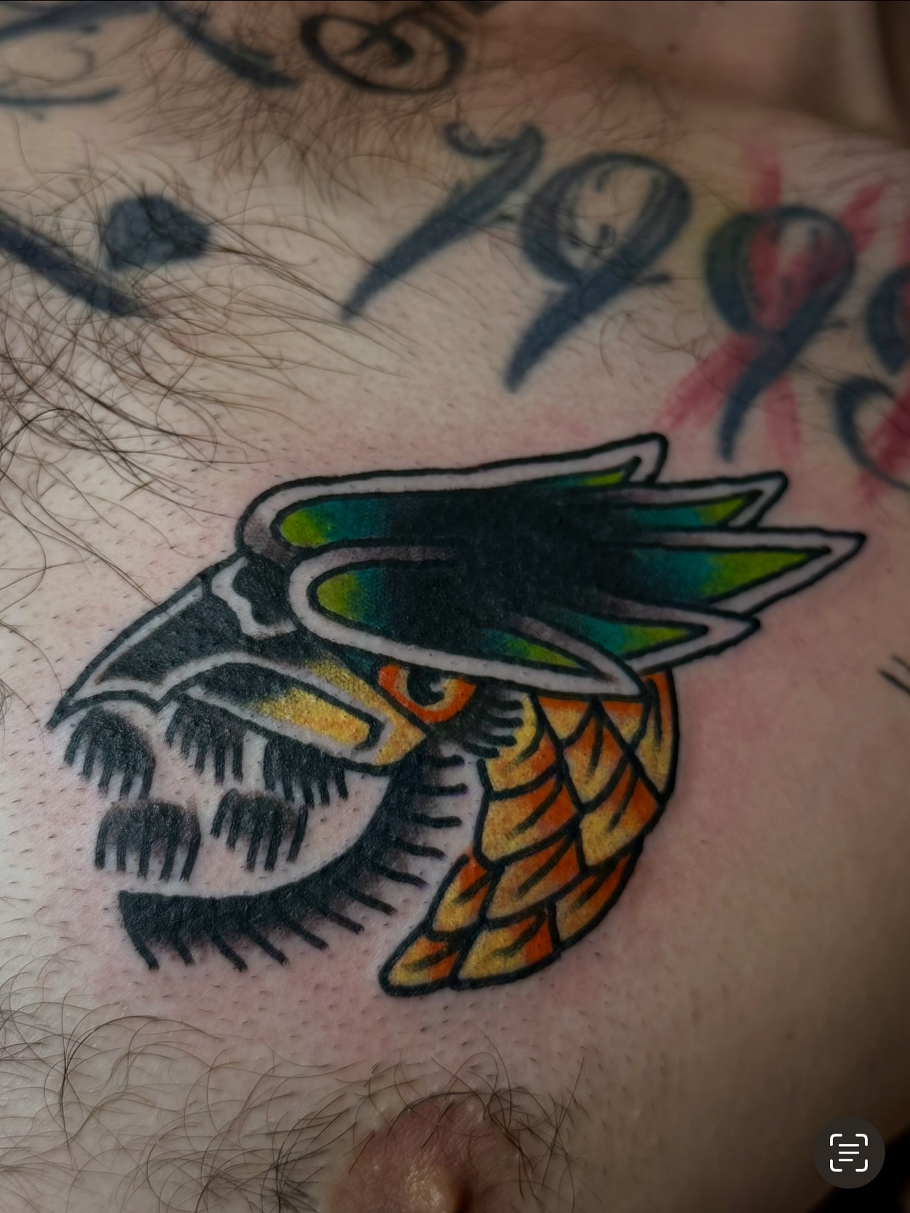 Owl American traditional tattoo on the chest by Zac Clark