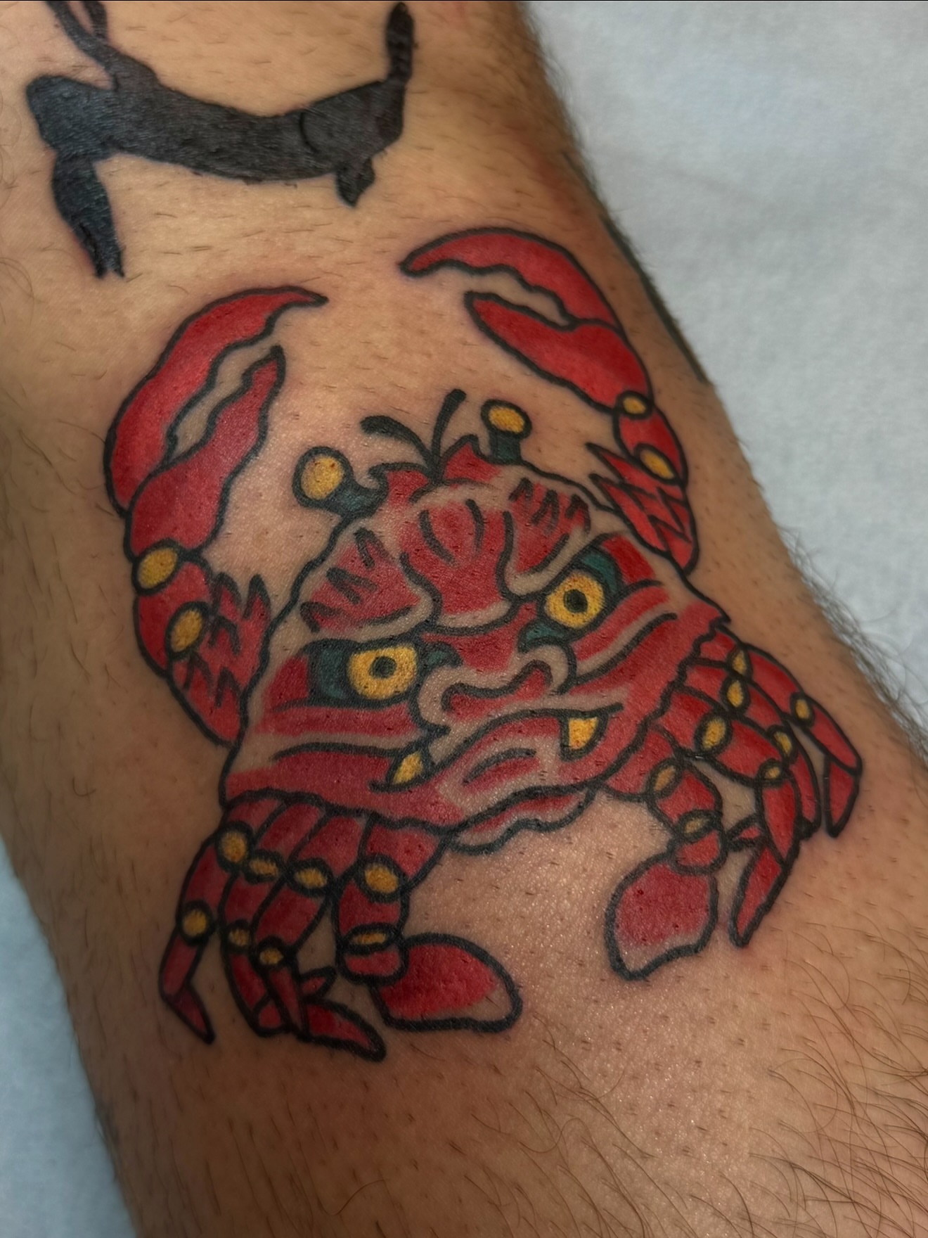 Crab American traditional tattoo on the leg by Zac Clark