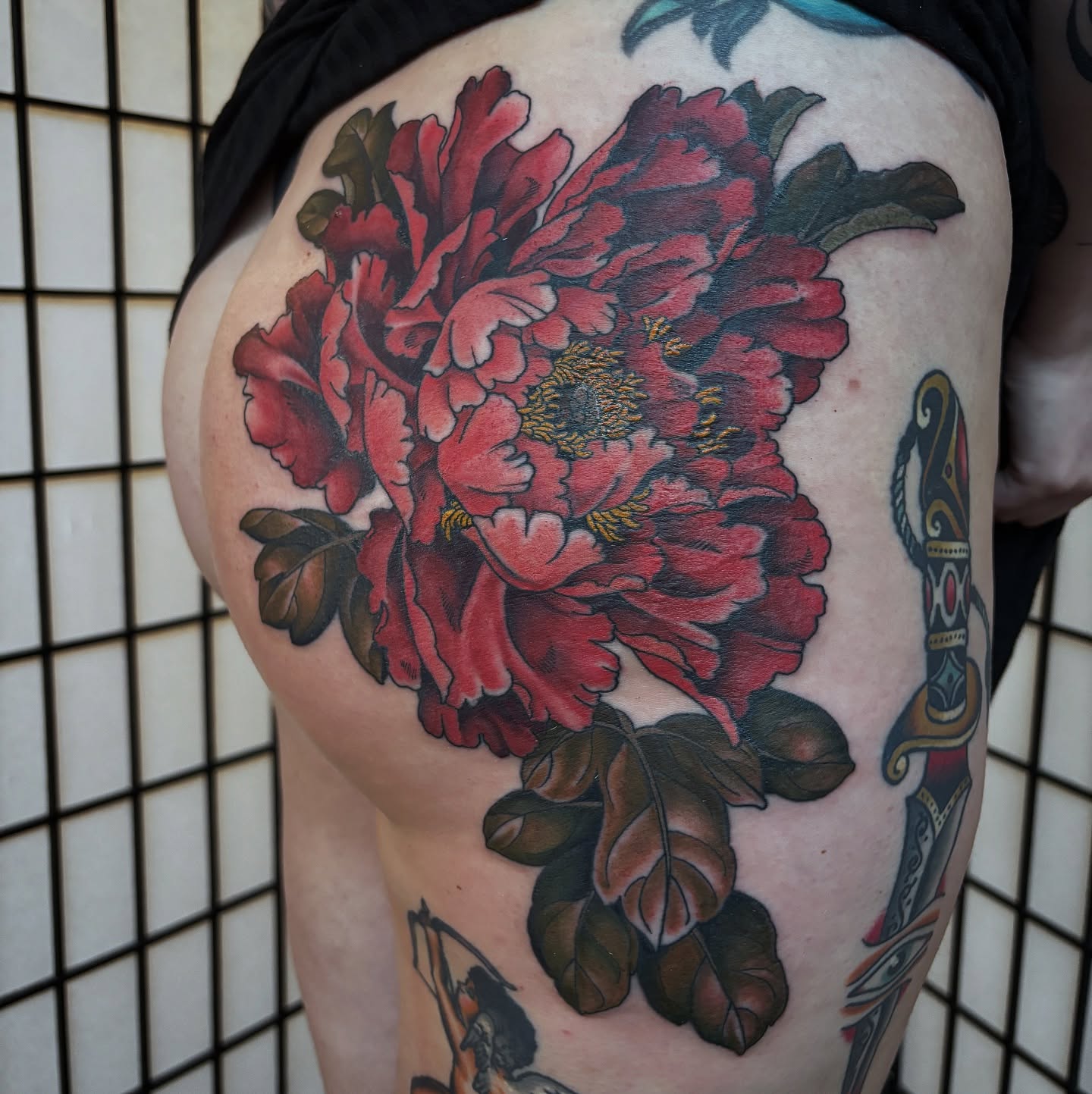 Peony American traditional tattoo on the thigh by Adam Bailey, Portland, Oregon