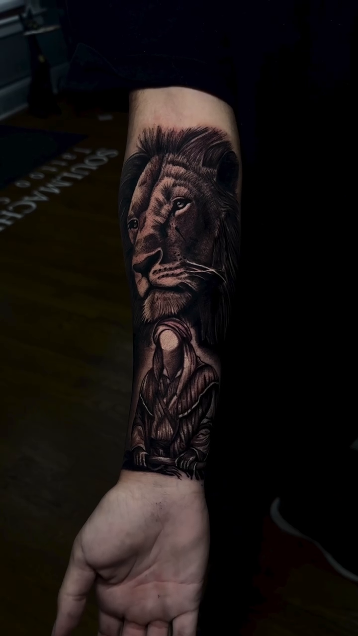 Lion and figure realism tattoo by caleb coley