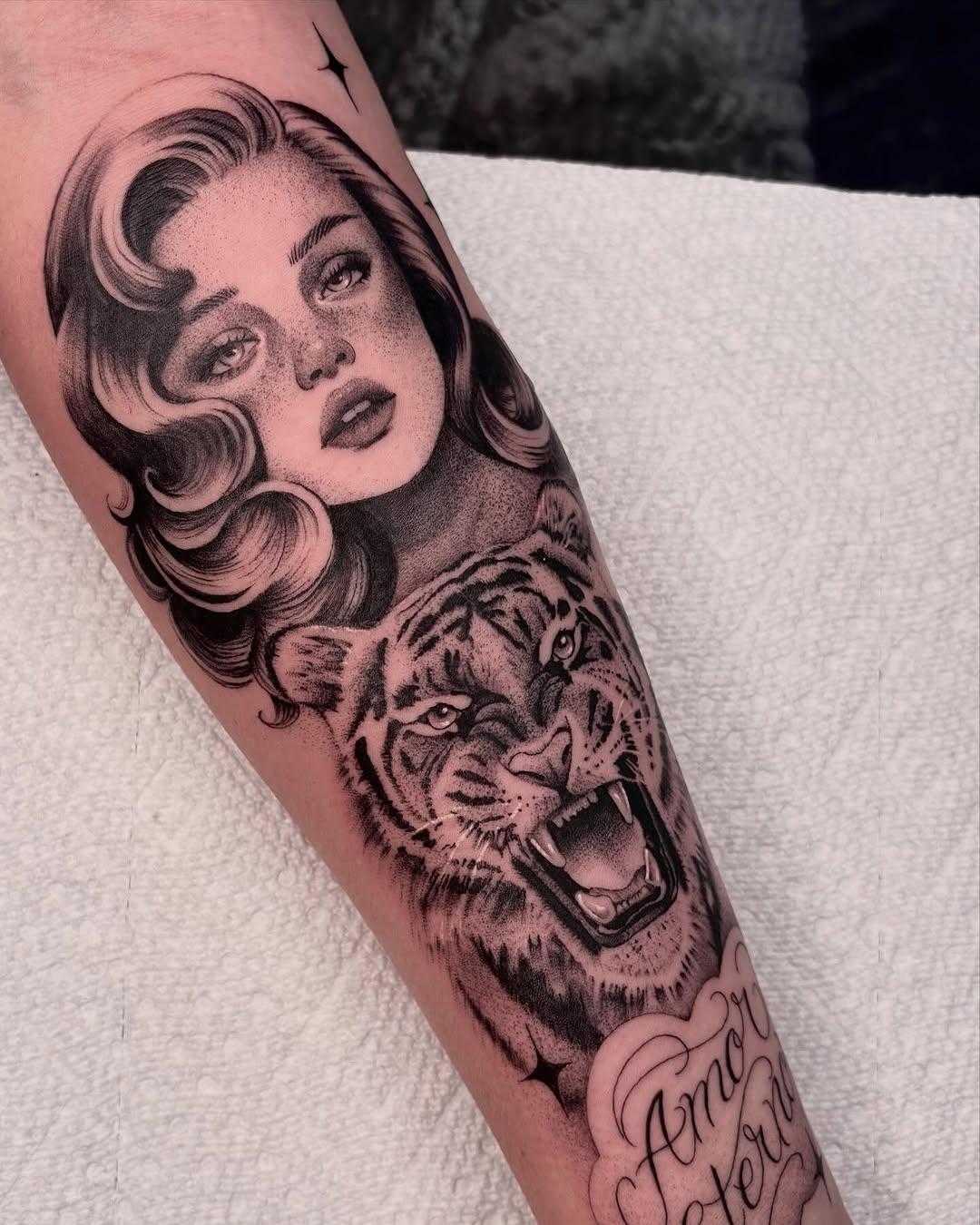 Woman and tiger realism tattoo on the forearm by Avery Mullins