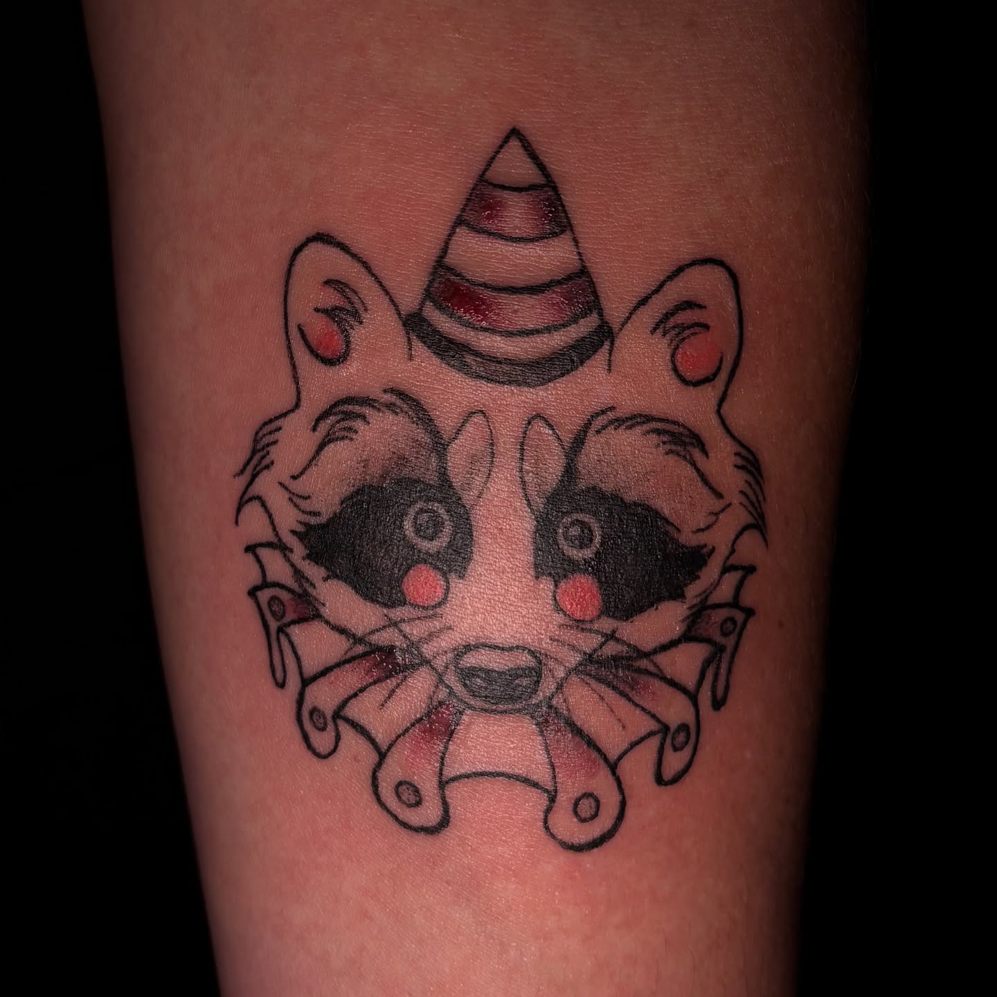Raccoon American traditional tattoo on the forearm by Rachel
