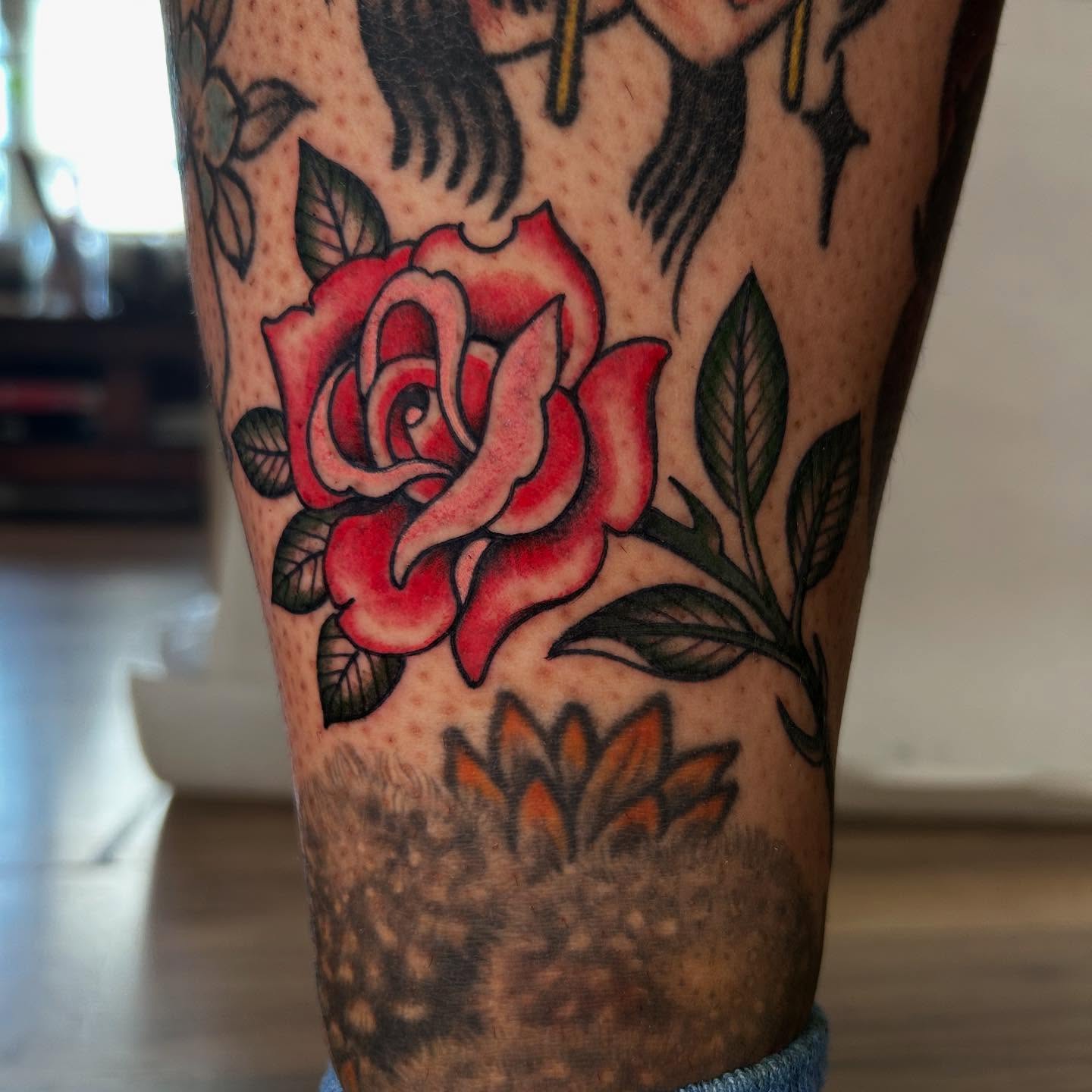 Red rose American traditional tattoo on the forearm by Katie Dexter, Des Moines, Iowa
