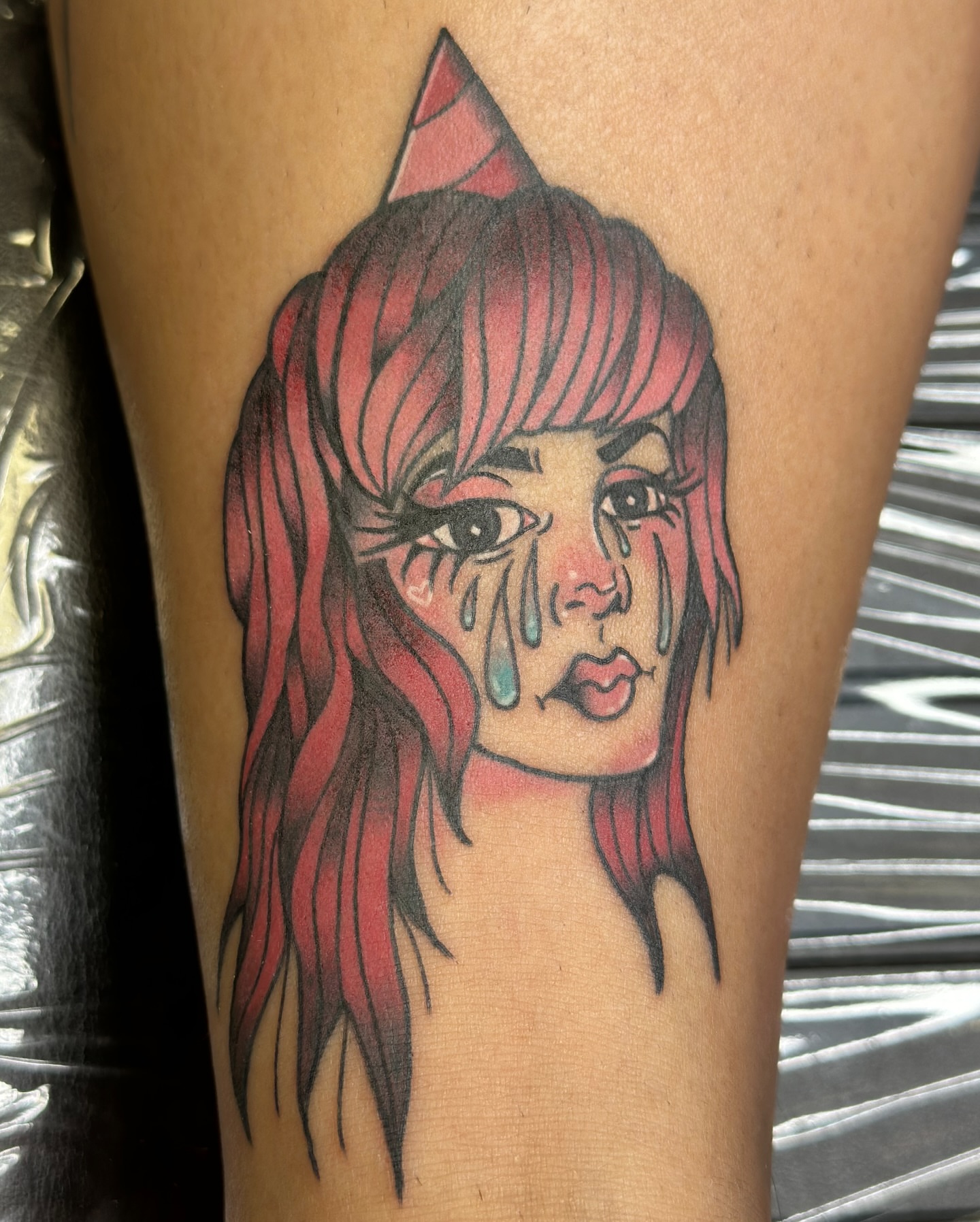 Crying girl American traditional tattoo on the thigh by Ash Nicole Painterly, San Diego, California
