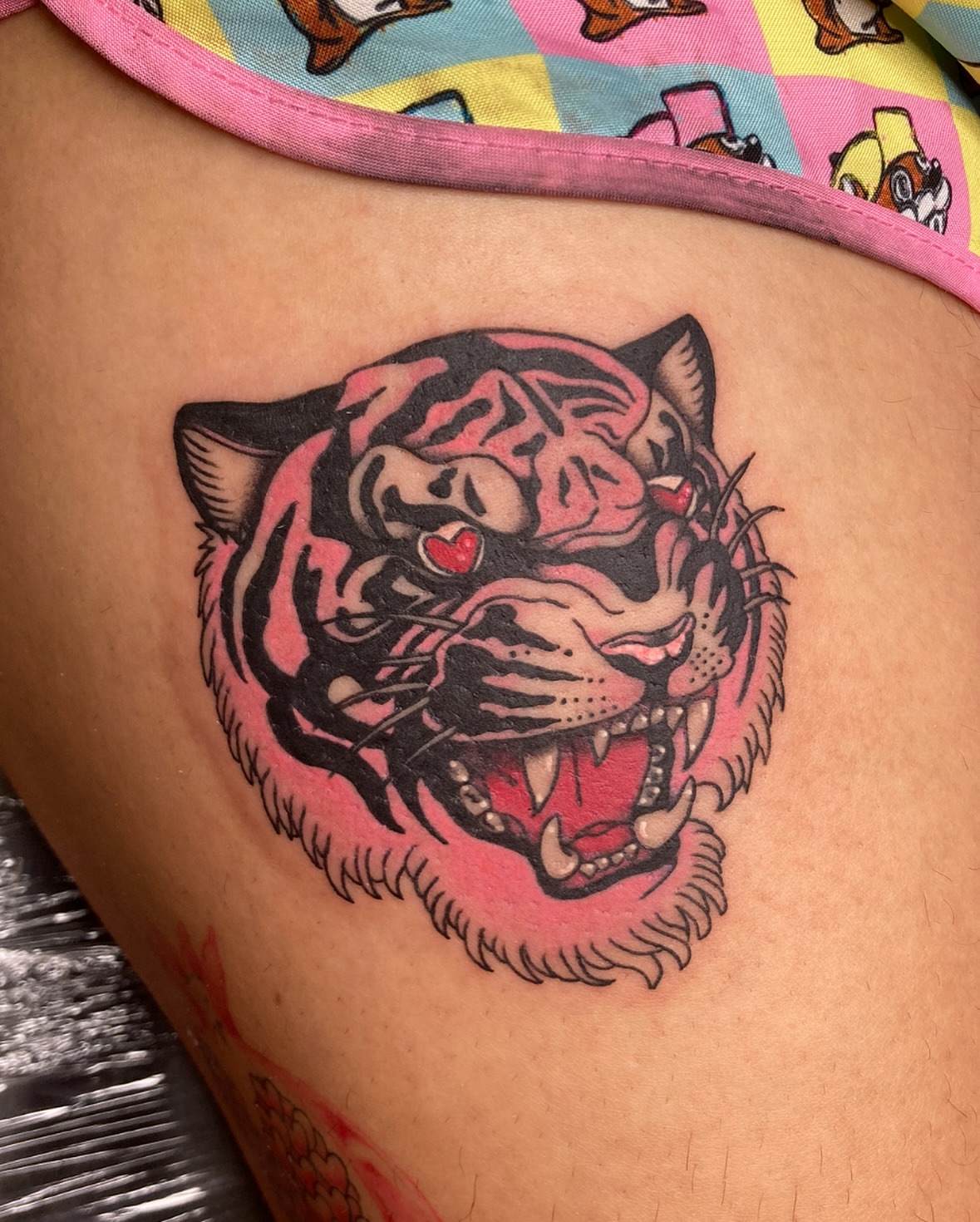 Tiger American traditional tattoo on the thigh by Ash Nicole Painterly, San Diego, California