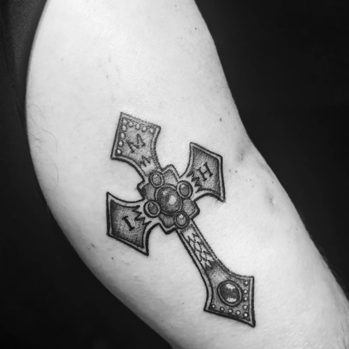 Iron cross black and grey tattoo on the forearm by Juanma Martin