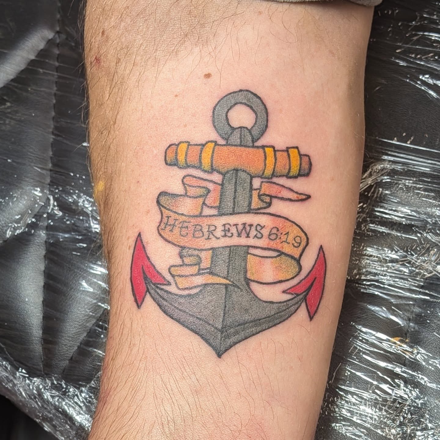Anchor with scripture American traditional tattoo on the forearm by Kam