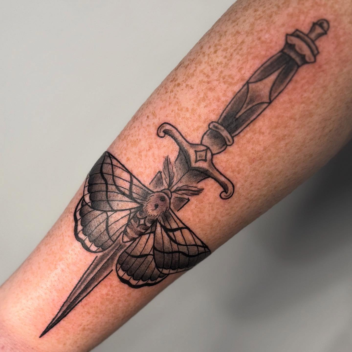 Knife and moth geometric tattoo on the forearm by Ashley Rose - Minnesota Tattoo Artist