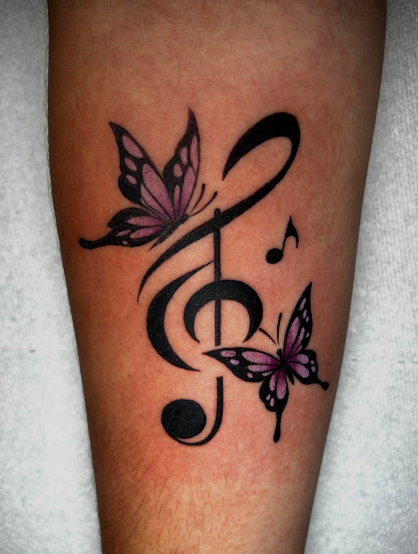 Music note and butterflies ornamental tattoo on the forearm by ✶ 𝓑𝓲𝓽𝓮𝓼𝓲𝔃𝓮𝓭 𝓘𝓷𝓴 ✶, Buford, Georgia