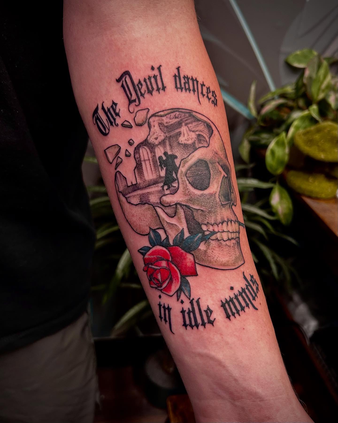 Skull and rose black and grey tattoo on the forearm by Jon Byrd