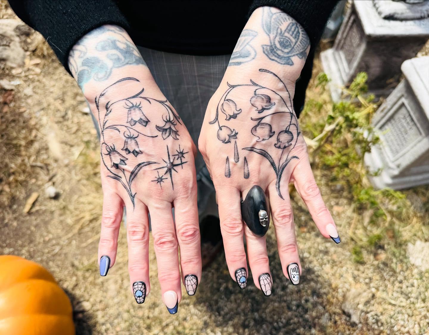 Floral design black and grey tattoo on the hand by Hannah Edwards, Austin, Texas