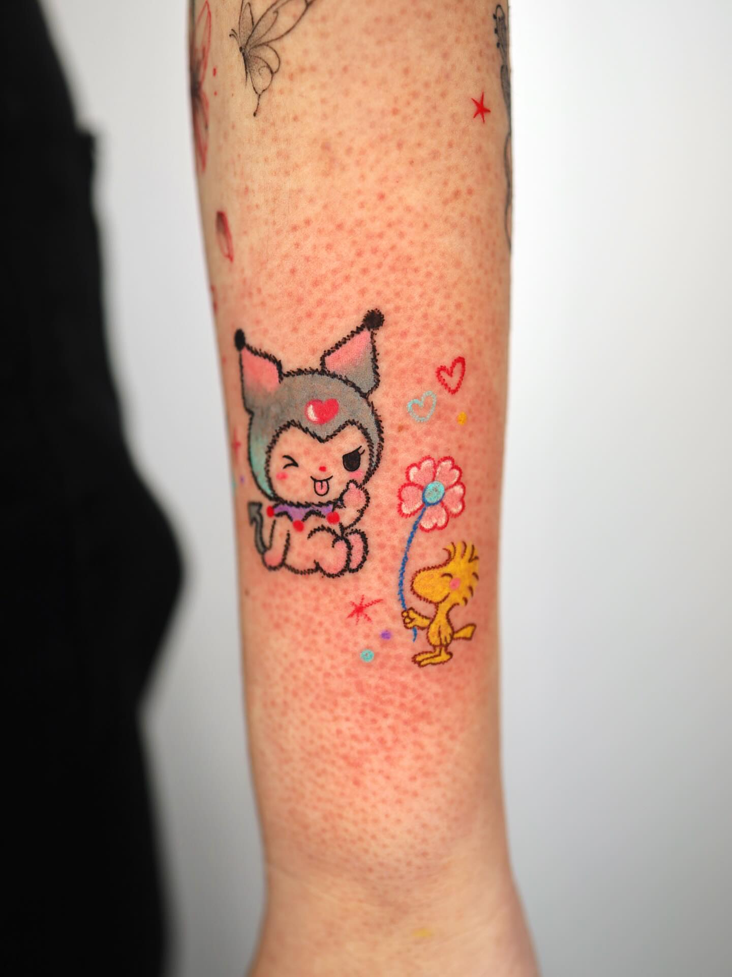 Kawaii character and dog dotwork tattoo on the forearm by Kettle🤍케틀