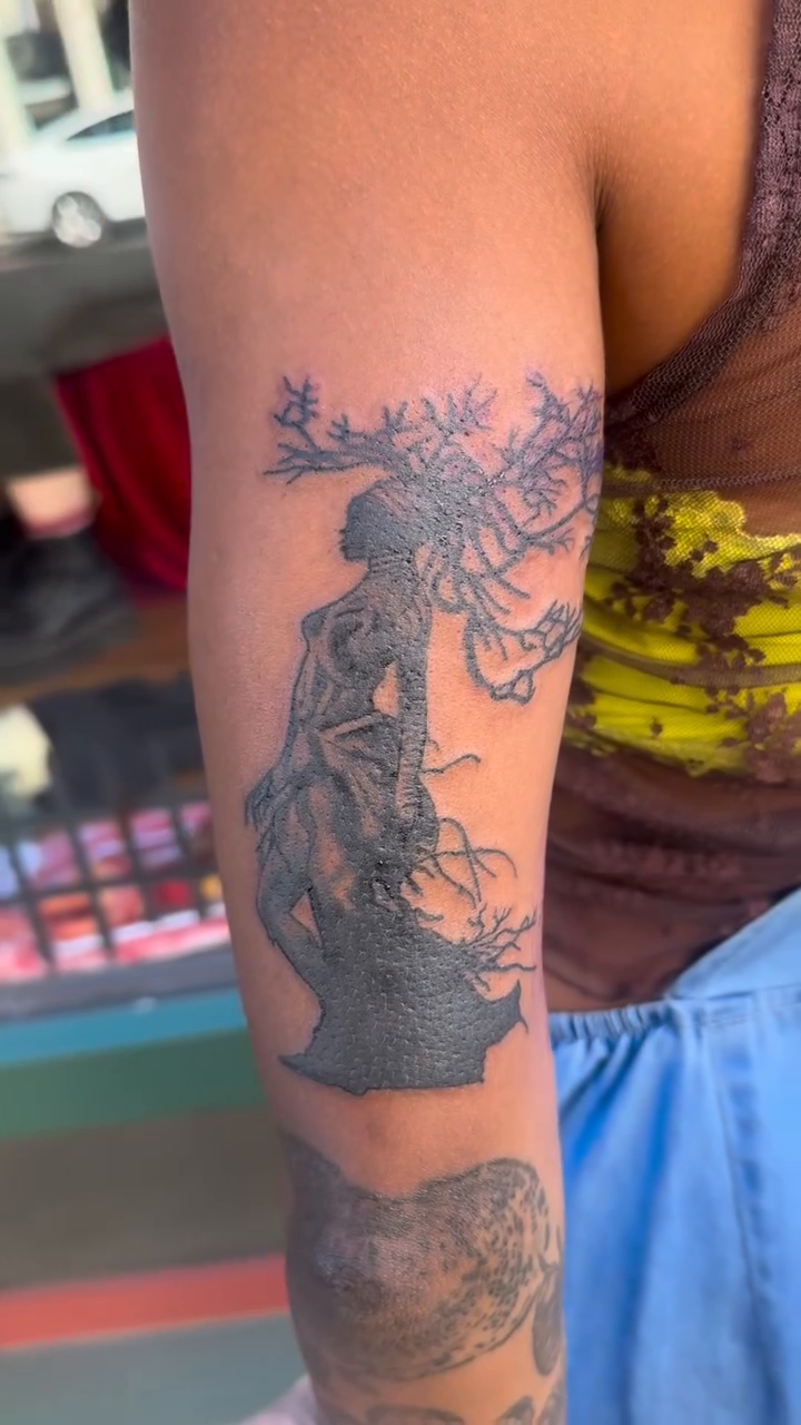 Woman with flowers realism tattoo by Misty Dawn Brothers, Dayton, Ohio