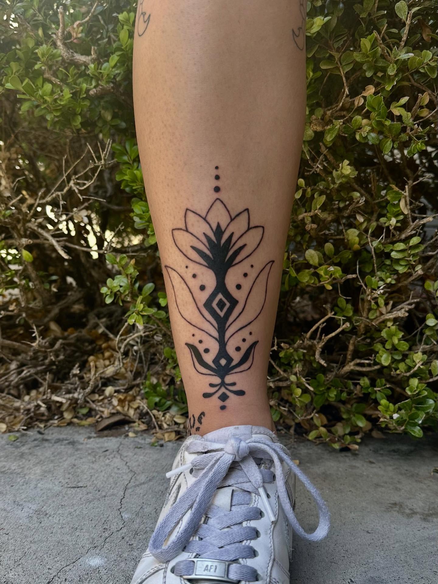 Lotus flower dotwork tattoo on the forearm by Jadelin, San Francisco, California