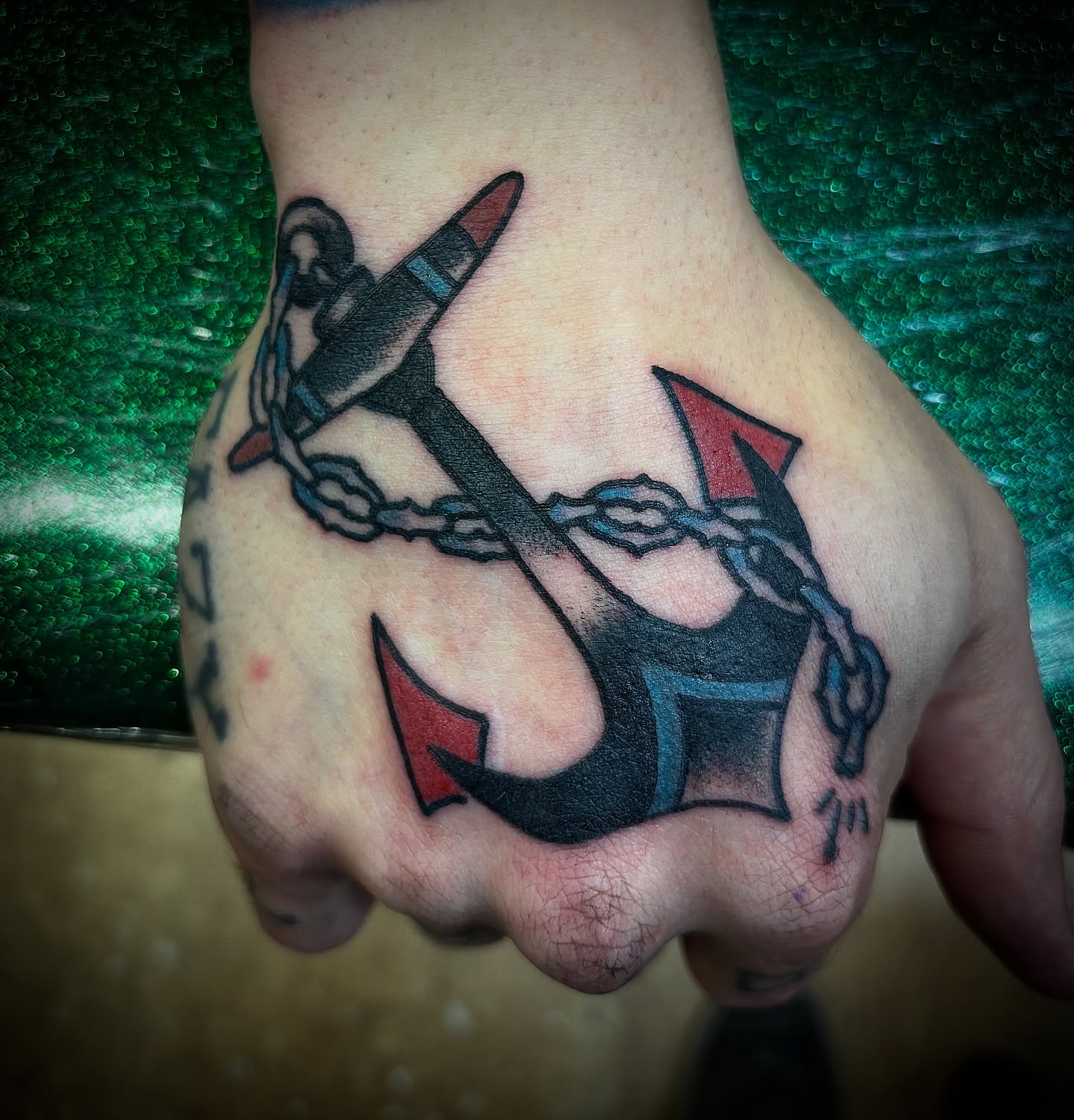 Anchor and chain American traditional tattoo on the hand by Tattoos Las Vegas,NV