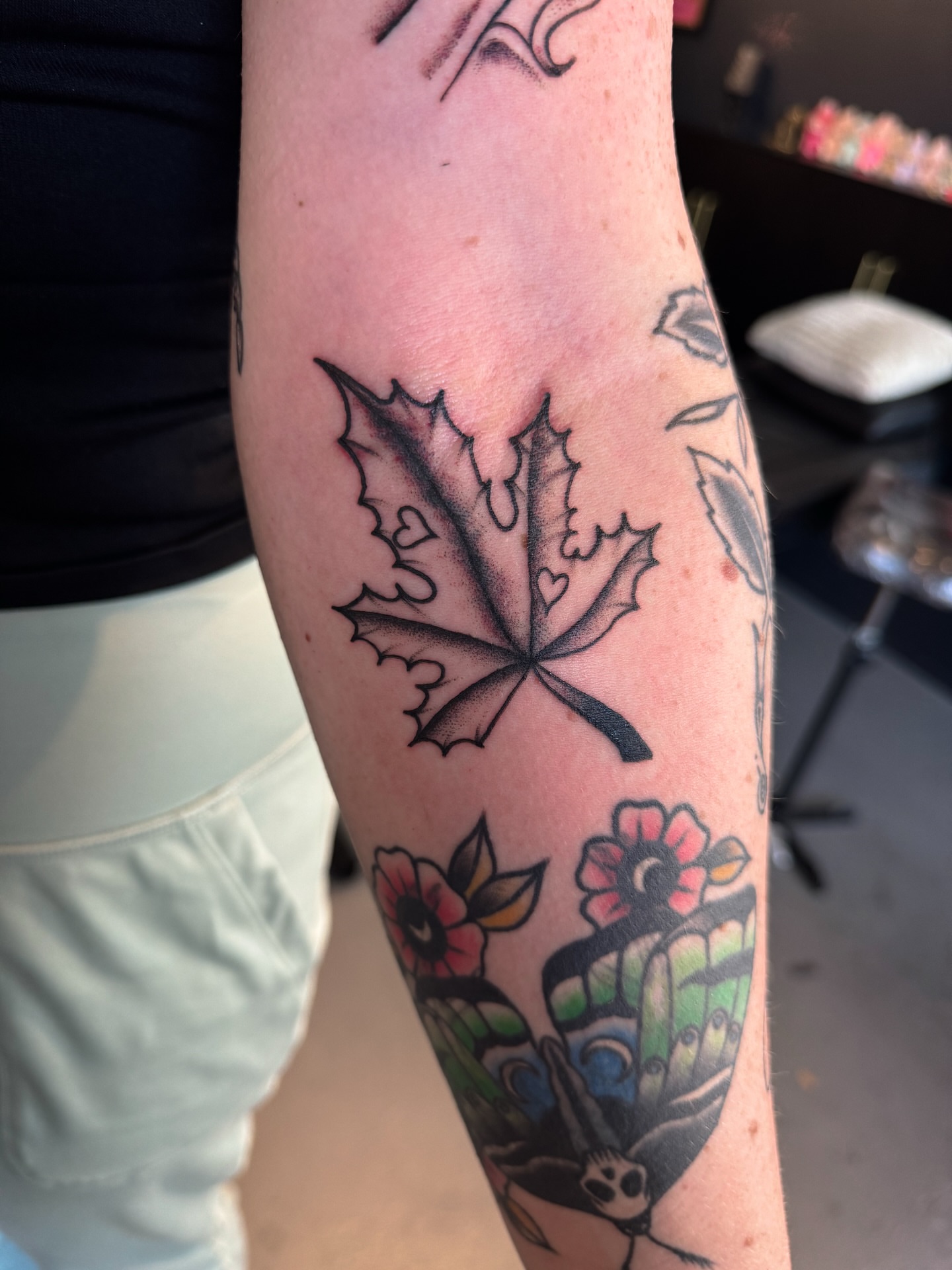 Maple leaf American traditional tattoo on the forearm by @inkspirationtattoo_co