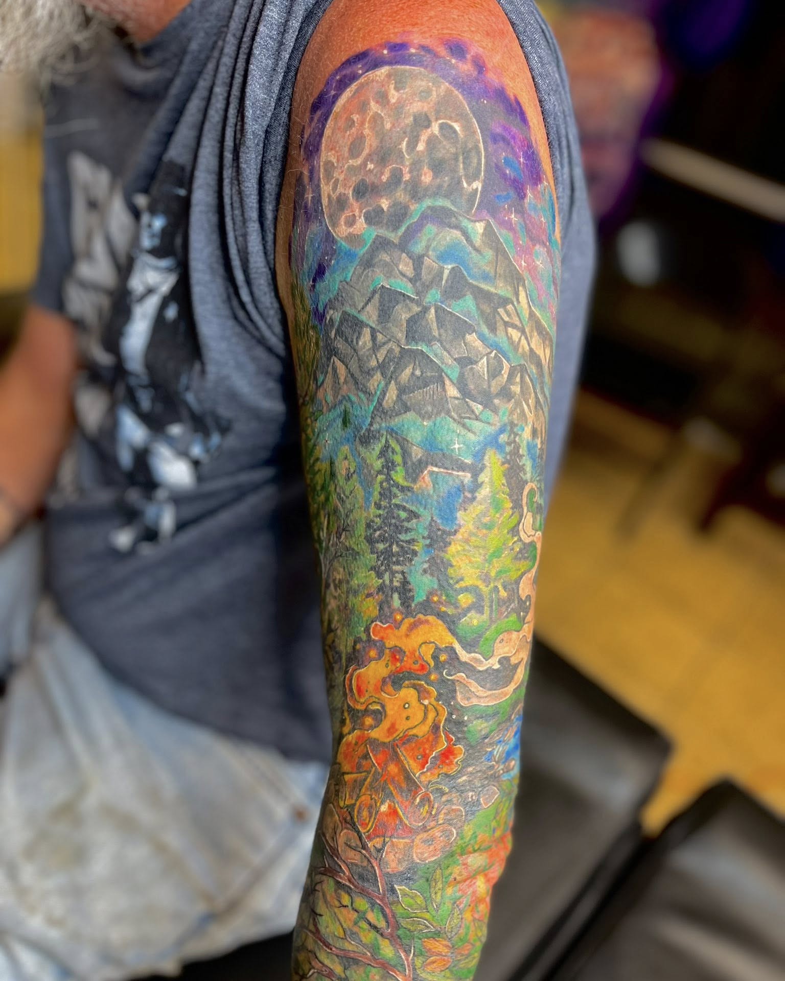 Mountain landscape geometric tattoo on the forearm by Jessica DarkRabbit