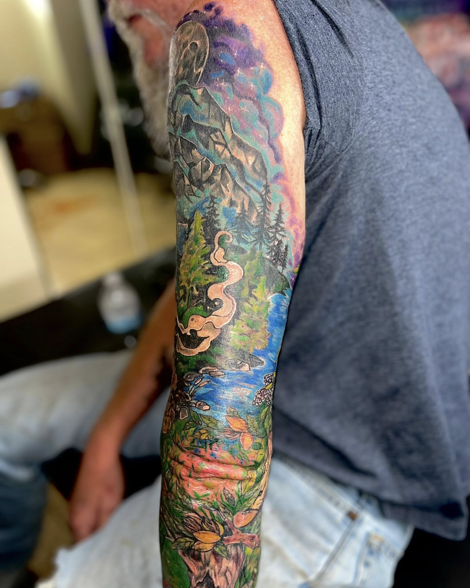Forest landscape realism tattoo on the forearm by Jessica DarkRabbit