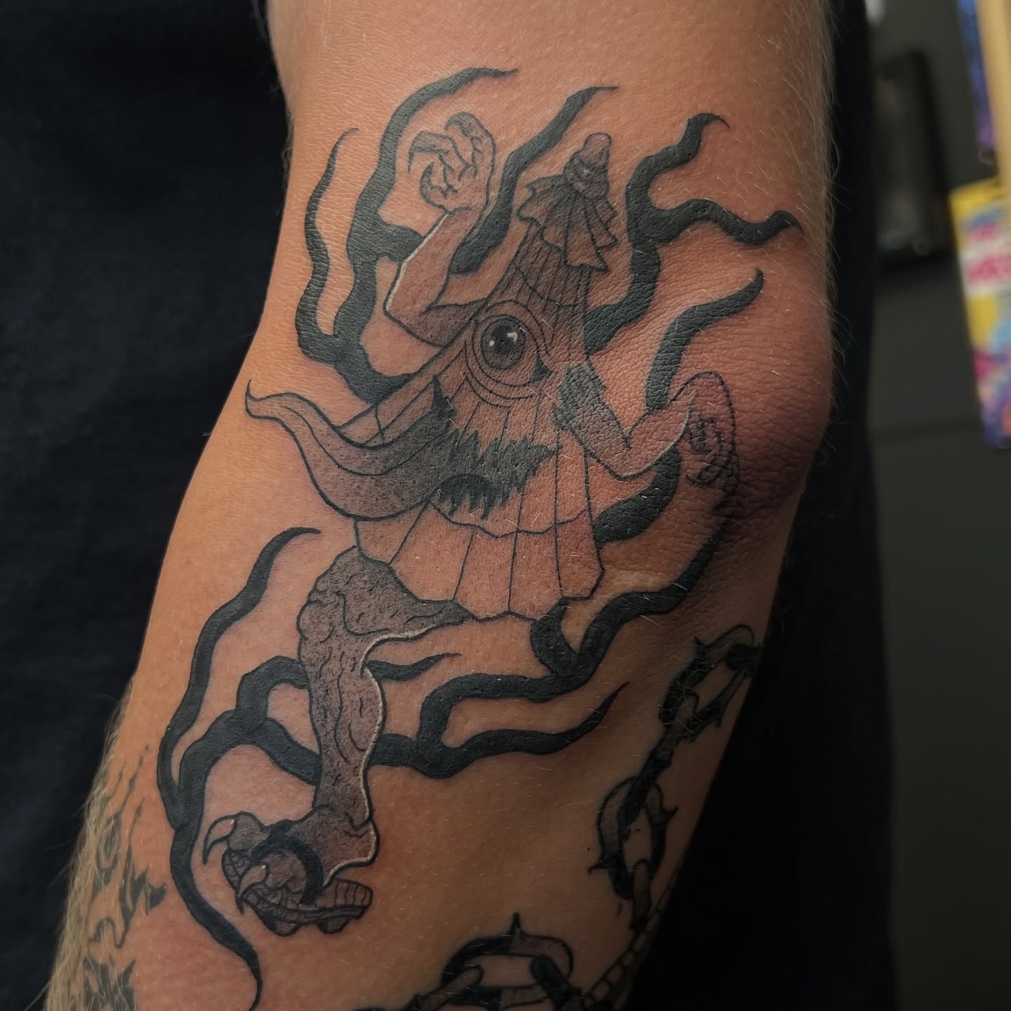 Octopus black and grey tattoo on the forearm by Leslie Paskoff