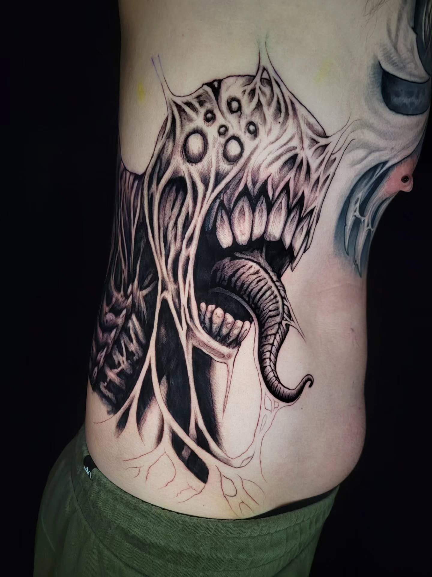 Tattoo by @necronomiconnor — dark_realism, black_and_grey