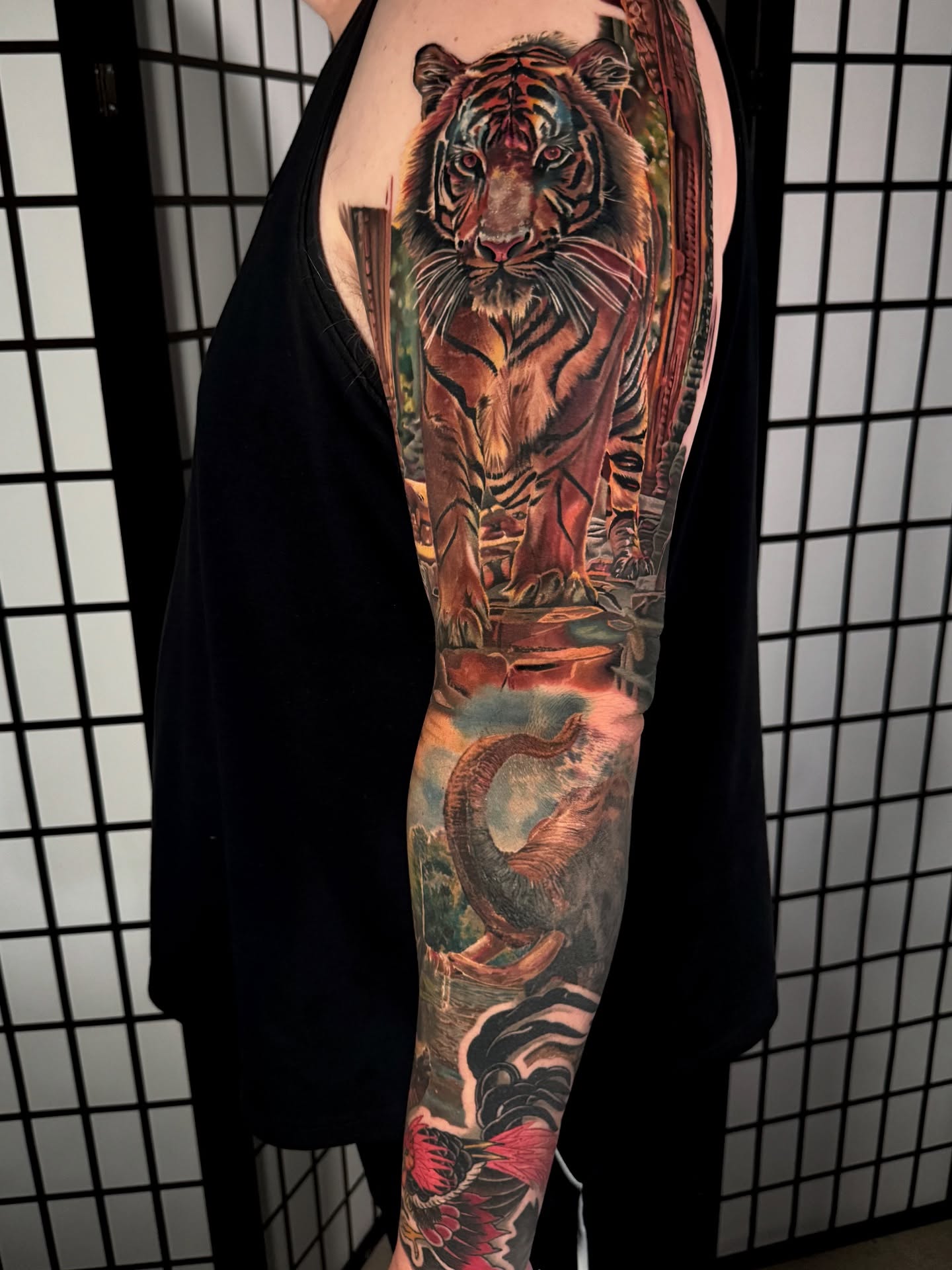 Tiger realism tattoo on the forearm by Justin Shelpman