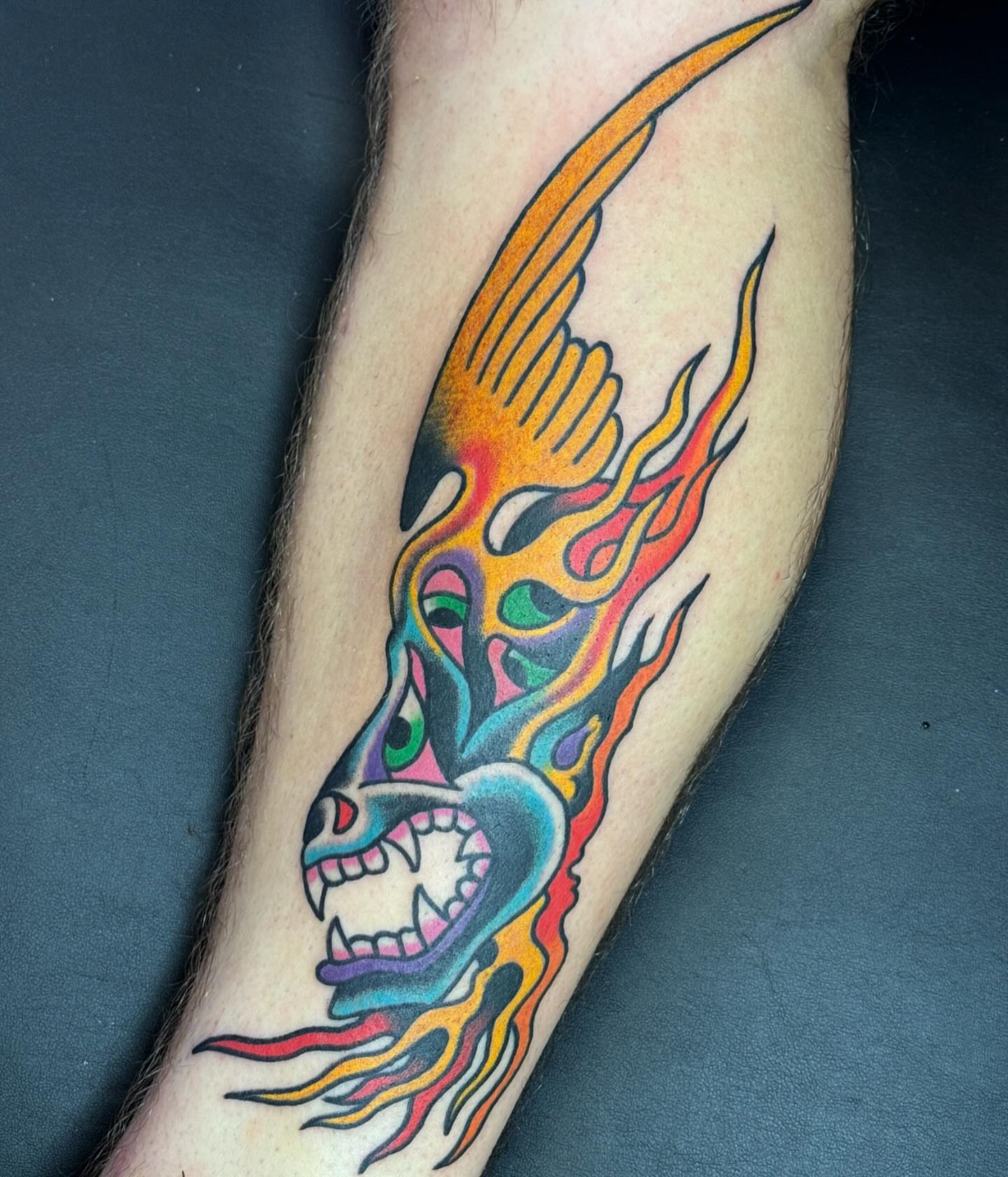 Flaming skull American traditional tattoo on the forearm by Sam Hambrick, Watchung NJ