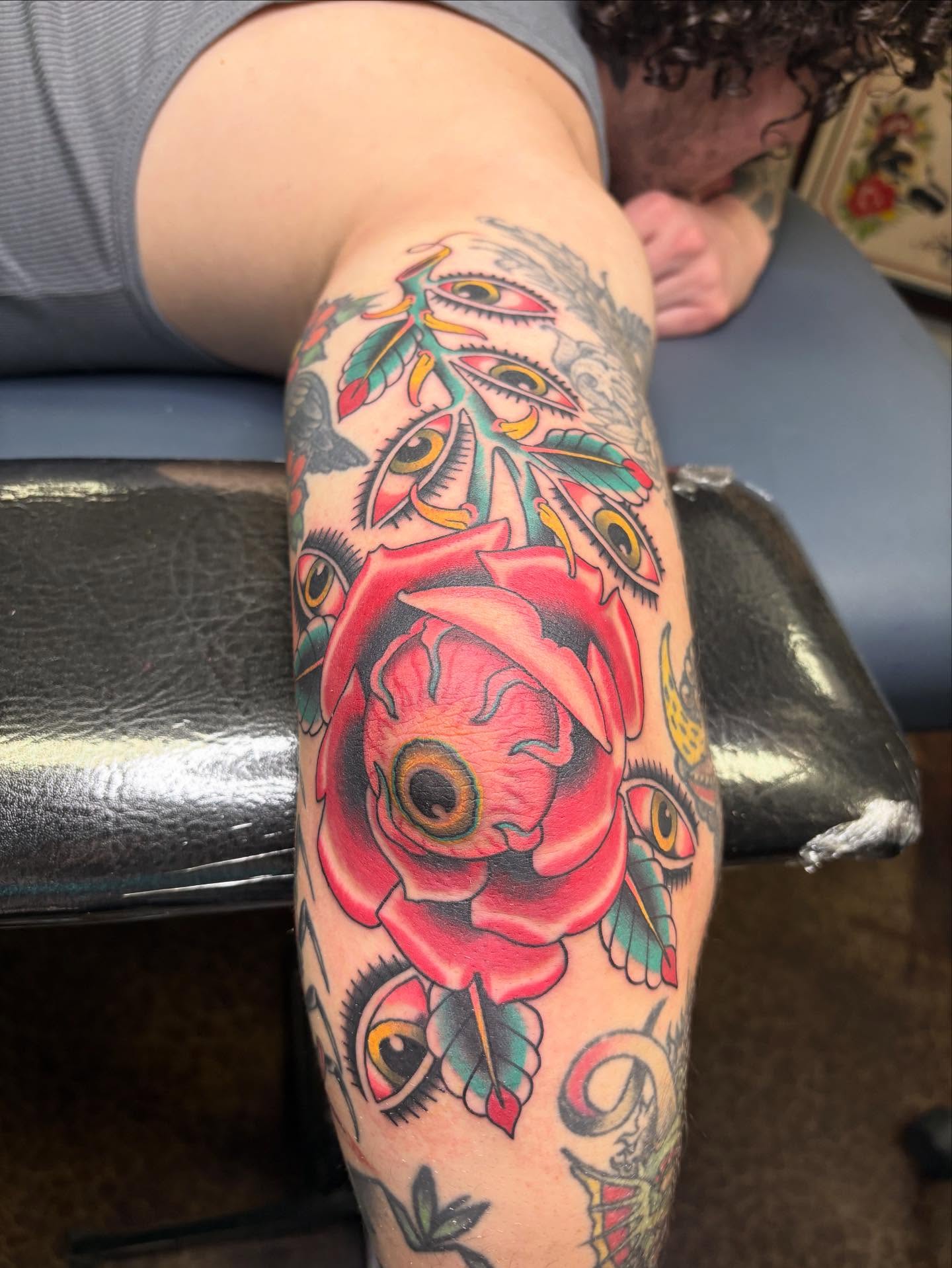 Rose and eyes American traditional tattoo on the forearm by Jakob Ristau, Kansas City, Missouri