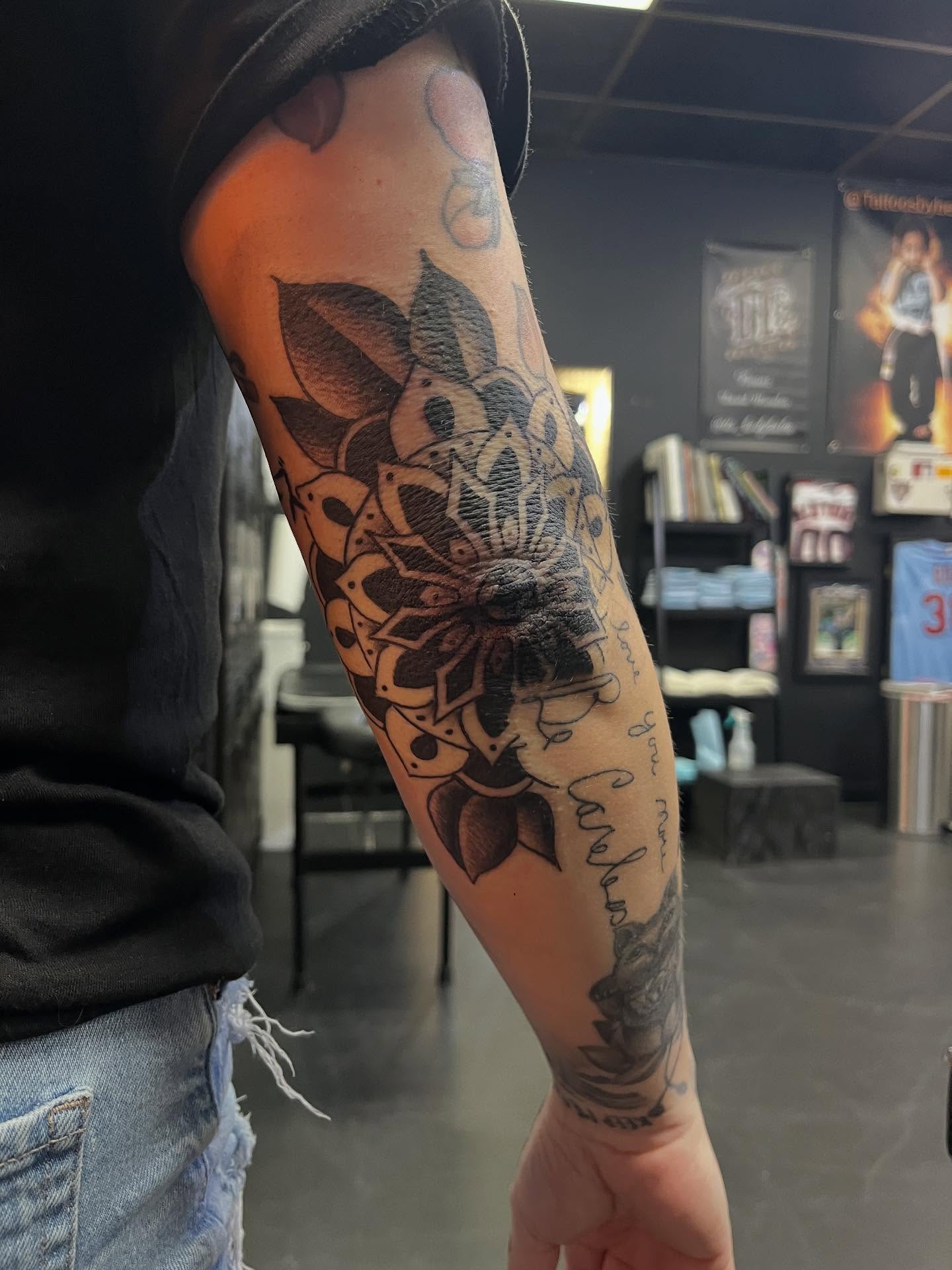 Lotus flower black and grey tattoo on the forearm by CRAIG B⛓️ Cincinnati Tattoo Artist
